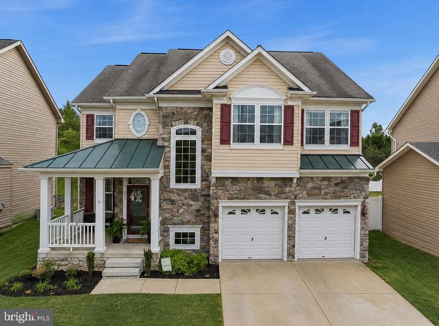 Welcome home to this stunning stone front home in the highly sought after Prince Frederick Crossing community. This is the kind of home that feels inviting the moment you arrive and only gets better as you step inside. The curb appeal immediately stands out with a beautiful stone front, covered front porch, and well maintained flower beds that give the home a warm, welcoming presence. It is easy to picture yourself enjoying a quiet morning or winding down in the evening right on the front porch.  Inside, you will find an open floor plan with wood floors throughout the main level, freshly painted walls, and a layout that makes everyday living and entertaining feel effortless. Natural light fills the home, and there is a great balance between open flow and defined rooms. With 5 bedrooms, 3.5 bathrooms, and 3,766 square feet of finished living space, there is plenty of room to spread out and make it your own. The main level features a large dining room that is perfect for hosting holidays and gatherings, along with a versatile bonus room that works well as a home office, playroom, or additional living space. The kitchen truly serves as the centerpiece of the home. It offers updated cabinetry, granite countertops, stainless steel appliances, a cooktop, pantry, and a large island with seating that naturally becomes a gathering spot. The breakfast nook overlooks the backyard and gives you a comfortable place to start your day or enjoy a nice meal. Just off the kitchen, the large family room is a space you will find yourself escaping to every day, complete with one of three fireplaces that add both comfort and character. Upstairs, the primary suite is spacious and designed to feel like a retreat. With vaulted ceilings, its own fireplace, and two walk in closets, it offers both comfort and functionality. The ensuite bathroom includes a soaking tub, separate shower, and dual vanities, giving you the space you need to relax and recharge. Upstairs you also have three generously sized bedrooms and the convenience of a bedroom level laundry room that makes everyday routines that much easier. Downstairs, the finished basement provides even more room to spread out, whether you are looking for a rec room, home gym, or additional living area. With built in speakers, it is also a great space for entertaining or movie nights.  Out back, the fully fenced yard backs to a farm, offering privacy and peaceful views that are hard to find. The deck, also equipped with built in speakers, is perfect for hosting, grilling, or simply enjoying some quiet time outdoors. Living in Prince Frederick Crossing gives you access to a variety of community amenities including a basketball court, multiple playgrounds and tot lots, walking paths, baseball and football fields, and a clubhouse. Located in the heart of Prince Frederick, you are just minutes from schools, shopping, restaurants, and entertainment, with an easy commute to Washington DC and PAX Naval Air Station. If you have been waiting for a home that offers space, comfort, and a great location, this one is definitely worth seeing in person.