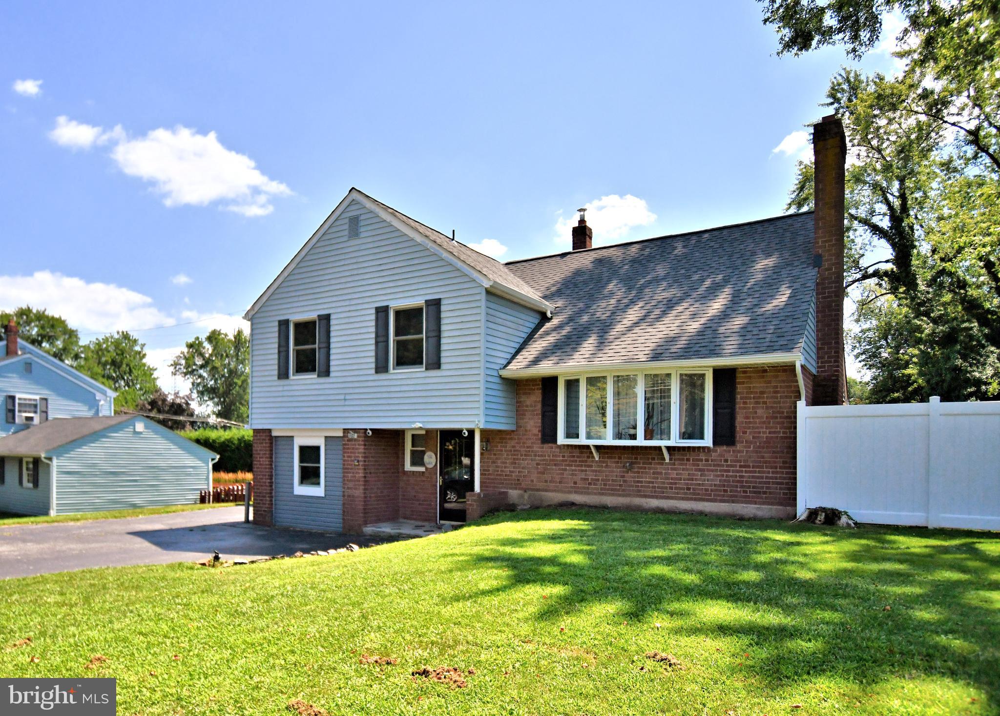 Situated in the desirable Colonial School District, this spacious 4-bedroom, 2.5-bath split-level home offers over 2,400 square feet of well-designed living space in the heart of Plymouth Township. The bright and welcoming layout is ideal for both daily living and entertaining, featuring a generous living room with crown molding, a fireplace, and sliding glass doors that open to an expansive 19x31' deck, perfect for outdoor gatherings or quiet evenings. The fully fenced backyard offers privacy and space for pets, gardening, or play. The beautifully renovated kitchen showcases classic white cabinetry, granite countertops, glass tile backsplash, under-cabinet lighting, a breakfast bar, and a separate dining area with deck access. Upstairs you’ll find three spacious bedrooms and a full bath on one level, and a private primary suite with a full bath and ample closet space on the next. The lower level includes a tiled foyer entry, half bath, laundry area, and a family room, making it perfect for guests, recreation, or relaxing at home. Additionally, the former garage has been converted into a versatile room currently used as a home office, generously sized and filled with potential. It can serve as an office, gym, guest space, playroom, or hobby room to suit your needs. Hardwood floors run throughout the main level, and thoughtful upgrades include new roof, foam insulation, newer HVAC, hot water heater. Parking is no issue with an oversized driveway that accommodates 6–7 cars, ideal for multi-vehicle households or entertaining. Conveniently located minutes from the Plymouth Meeting Mall, community parks, major highways (202, 476, and the Turnpike), and local dining and shopping. This well-maintained home offers the perfect blend of comfort, flexibility, and convenience in one of Montgomery County’s most sought-after communities Plymouth Meeting.
