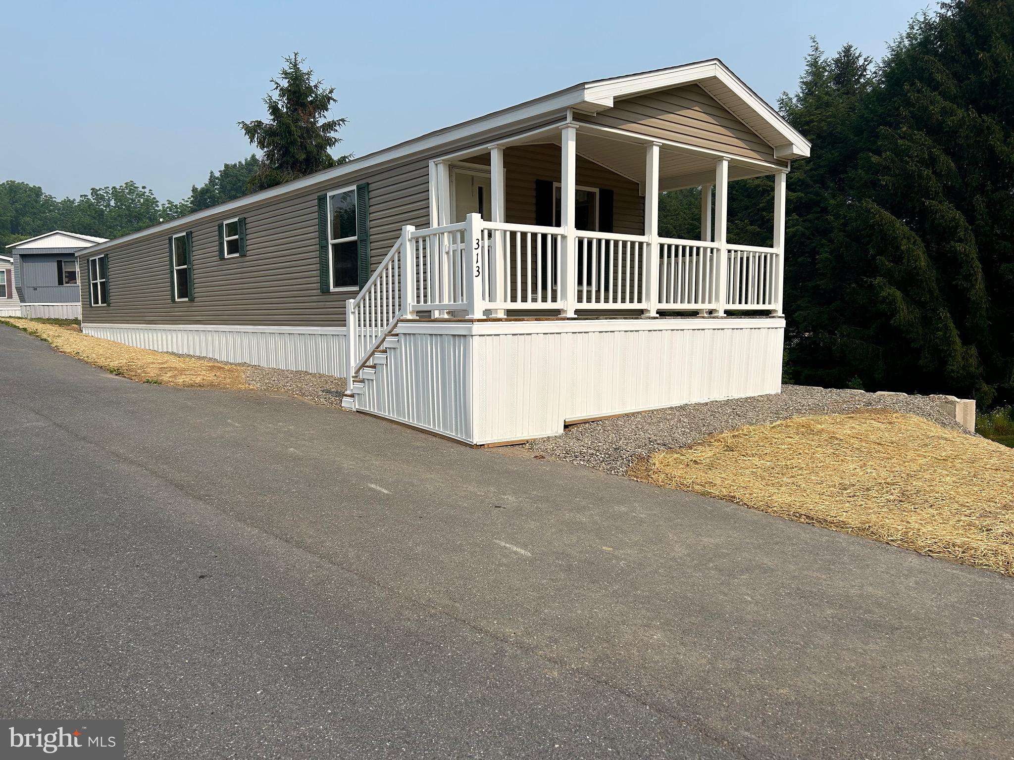 Welcome to Cindy’s MHP and great 55+ community. Here you find a 2017 Colony that was just over into the park. This 2 bed/1bath home, was updated with all new vinyl plank flooring and a fresh coat of paint. There is also have a nice rear deck as this home is a front porch model. There is also a new A/C system. All applicants must be Park approved in here to the pet guidelines. The current lot rent is $450 a month and include snow, sewer. Trash is $12.50 per month.
Since this home was recently moved in the park we are waiting for the tax identification number to be assigned.