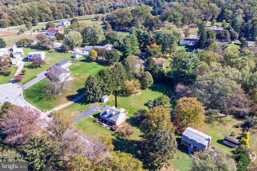Welcome home to this lovey home centrally located in Sykesville and minutes from I-70.  This charming home has 3 bedrooms (main floor bedroom has a room/pantry right next door could be used to add an additional bath ) and 2 full baths and sits proudly on a huge lot (.78 acres)  in the private neighborhood of Piney Run Estates.  Imagine all the outdoor fun you will have sitting on the back deck relaxing while overlooking your large lot. 
The basement is a full walkout with fireplace and full bath ready for your finishing touches.  The also features a  second fireplace in the living room, an updated main bath, hardwood floors, large deck, eat-in kitchen with a window over the sink, and tons of storage.