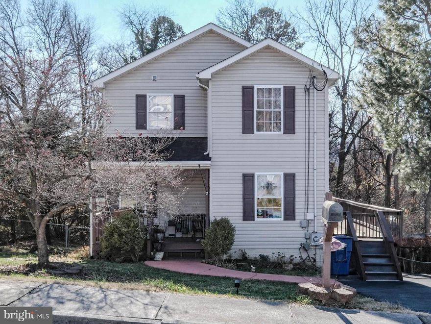 Don’t blink and miss this amazing price tag on this fantastic home that’s move-in ready and full of upgrades! Conveniently located for easy access to all Front Royal has to offer, this nearly 2,000 square foot home has a bright, open floorplan and a huge rear deck (40x16) that wraps around to the front paved driveway. From the inviting covered front porch to the usable fenced rear yard (with 2 sheds and garden area), from the cozy gas fireplace to the bonus office area that could be a 5th guest room (used as a craft room), this home is impressive both inside and out!  Be sure to note the major UPDATES in 2019/20 including: New HVAC system, New stainless appliances, New hardwood floors on main level, New toilet in primary bathroom, New toilet in upstairs full bath, Replacing of deck boards, Painting of porch, Sealing of deck, Painting of main floor and bonus room, New basement carpet, New sink/paint/toilet in half bath. In 2022/23 more UPDATES included: New carpet/paint in 3rd bedroom, Sealing of driveway/sidewalk, Addition of “sun sails” on deck, New water heater, Remodeling of laundry area, New washer/dryer.  BONUS FEATURES include: Gas fireplace, Dimmer lights throughout, Many new lighting fixtures, Butcher block laundry folding area and cabinets (Pinterest worthy!), Double sinks in primary bedroom, Extra deep pantry, Paved driveway, Rare in-town summer privacy (lovely fenced rear yard backs to trees), Storage under deck and so much more. NOTE: 4th bedroom in lower level has two windows and currently opens to recreation room with no door/wall separating the spaces-would make an ideal second main bedroom suite  area.