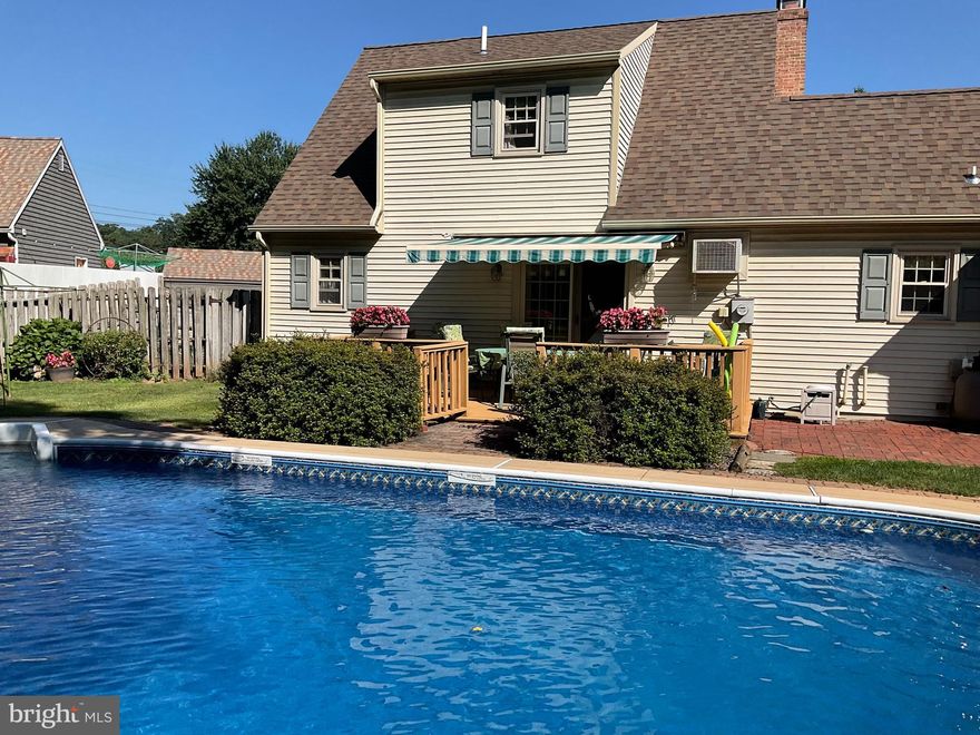 Welcome to this charming cottage-style home in the heart of Bowmansville, located in Brecknock Township and the Eastern Lancaster School District. This inviting Cape Cod-style residence offers three bedrooms, two and a half baths, and a finished basement.
The main floor features a primary bedroom with a walk-in closet. The sunlit kitchen and dining area include a seating island and provide easy access to the back deck, perfect for entertaining.  A cozy living room with a fireplace adds warmth and charm, while the main-floor laundry and oversized two-car garage offer everyday convenience.
Upstairs, two additional bedrooms share a full bath. The finished lower level expands the living space with a bar area and half bath, making it ideal for gatherings.
Step outside to a fenced-in backyard designed for relaxation and play. With plenty of space for children and pets, plus a pool for summer fun. Located within walking distance of the elementary school, this home combines comfort, convenience, and a great community setting.