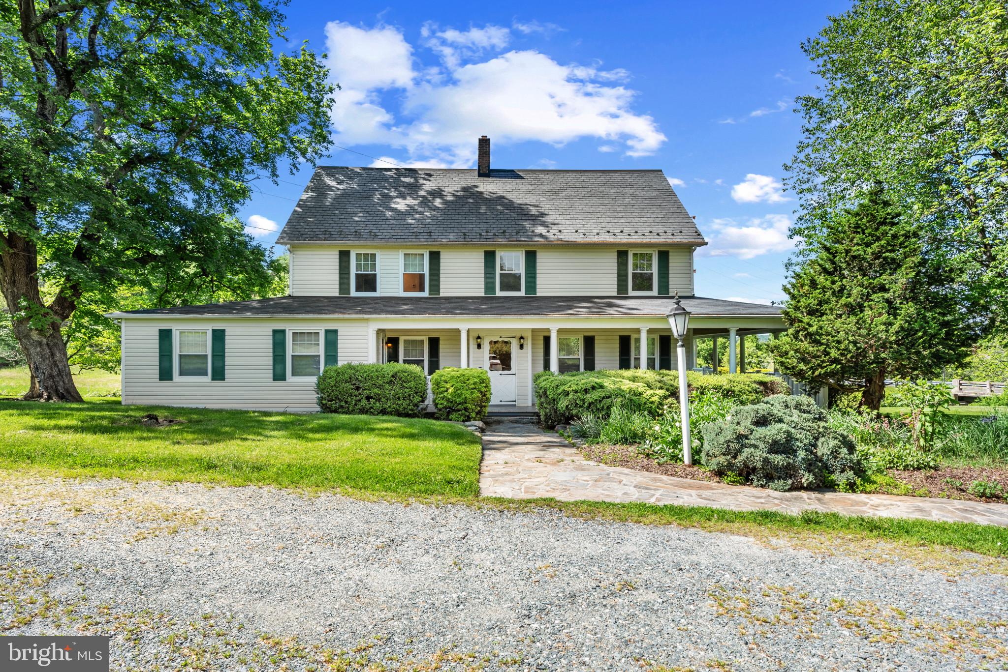 What a beautiful home in a gorgeous setting! 3 bedrooms and 2 and a half baths on 4 peaceful acres where serene views accompany you on every side. Wake up to the sounds of a stream flowing as you sit on the wrap-around porch sipping your morning coffee. Almost 3000 square feet of living space, all tastefully updated and yet with a farmhouse appeal. New energy-efficient Mitsubishi HVAC system (one for each living level) keeps your electric bill in check. 60'x80' pole barn with workshop and electric is a car collector's or worker's dream! Close to Rock State Park trails for hiking and to Deer Creek for swimming. Schedule your appointment to view this one-of-a-kind property today! You will love living here!