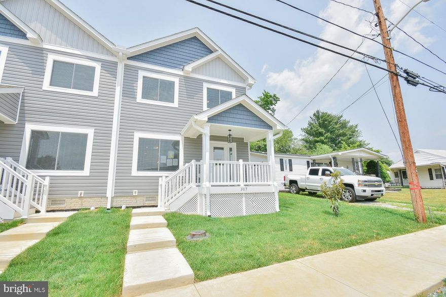 Beautiful brand new duplex with almost 1900 square feet of living space is waiting for a family. This home features 3 bedrooms and 2.5 baths. Open concept living room, kitchen and dining area. The kitchen offers stainless steel appliances, pantry, island and granite countertops. The separate family room allows more room to relax.  A laundry area is conveniently located on the upper floor which includes a washer and dryer. Walk out to your 10 by 8 deck  or sit out on your covered front porch and enjoy the morning sun.  This home has luxury vinyl flooring throughout. Located half a block from the new Fairfax Blvd. that goes from Ranson Circle to the Home Depot with walking paths. Make your appointment today.