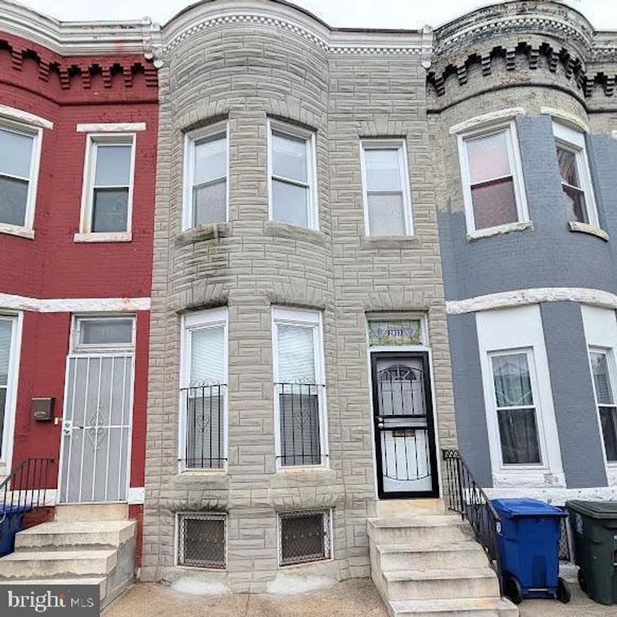 NOT FOR RENT, this classic Baltimore row house offers many original features such as marble steps, vestibule entry and inlaid hardwood floors.  New features include vinyl clad replacement windows, new storm door, new 2nd floor balcony, and newer roof.  Fenced back yard to private alley. 9' high ceilings throughout, even in the basement. Located in an up and coming neighborhood with lots of renovation going on. Perhaps you'd prefer to move in and upgrade this well-maintained home being sold strictly As-Is.  This home was previously rented for $1,200 a month with current city rental registration and lead certificate for immediate cash flow.