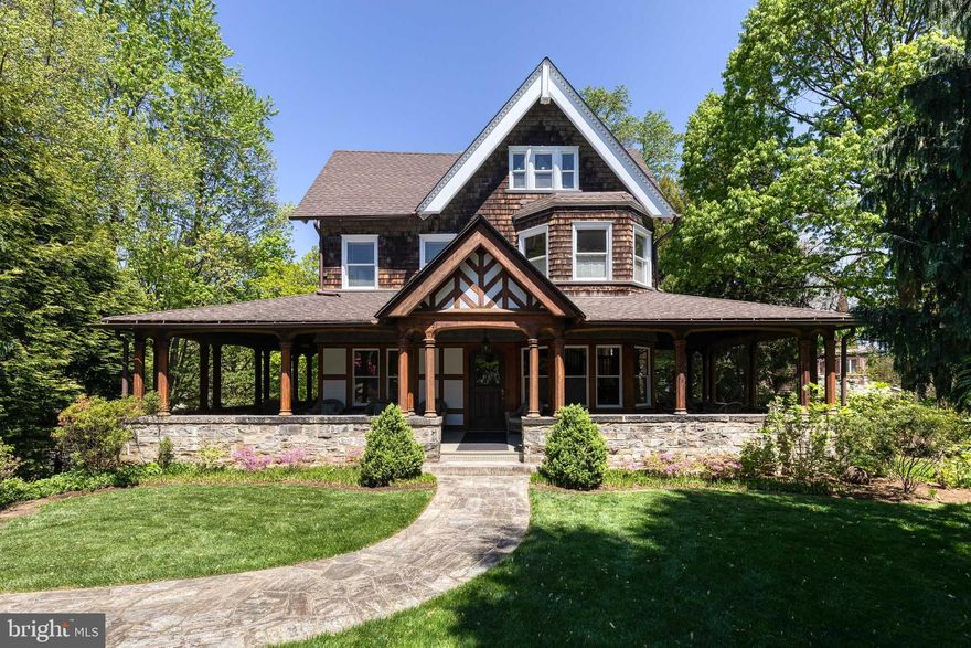Exceptional Properties. Exceptional Clients. Beautifully maintained and rich with timeless character, this exceptional Roland Park residence was originally designed in 1897 by renowned Philadelphia Main Line and Brandywine Valley architect William L. Price during the early years of his illustrious career. Showcasing striking medieval-inspired architecture, the home features granite stonework, stucco and timber detailing, leaded glass windows, gothic arches, dramatic roof gables and dormers, and a sweeping wraparound front porch with naturally finished columns, exposed rafters, rosettes, and garden views that evoke a romantic bygone era. Situated on a prominent half-acre corner lot facing southwest at the corner of Woodlawn and Elmhurst, this distinctive property offers mature landscaping, commanding curb appeal, and exceptional privacy that beautifully complements the home’s historic character. 

Offering seven spacious bedrooms and four-and-a-half baths, the home provides exceptional space for both comfortable daily living and elegant entertaining. Original architectural details have been thoughtfully preserved throughout, including soaring 10-foot ceilings, gleaming hardwood floors, sun-filled interiors, arched windows, and multiple wood-burning fireplaces that create warmth and timeless appeal. The gracious parlor welcomes guests with a grand staircase, while the cozy den, featuring custom built-ins offers a quiet retreat. A light-filled sunroom with striking arched windows extends off the formal living room and adjacent dining rooms-both anchored by wood-burning fireplaces-creating gracious, interconnected entertaining spaces ideal for holiday gatherings and memorable celebrations. 

The thoughtfully renovated kitchen perfectly balances beauty and functionality, featuring two sinks, generous prep and storage space, a six-burner gas range, adjoining butler’s pantry, and abundant windows overlooking the picturesque rear yard. A side entrance leads directly into the renovated mudroom and laundry area, creating effortless everyday convenience. A charming stone archway seamlessly connects the home to the expansive flagstone patio and lush backyard beyond.

Thoughtful updates enhance livability while honoring the home’s architectural integrity, including a renovated 2026 laundry and mudroom with a new LG high-efficiency washer, hardwired WiFi access throughout, a beautifully updated 2022 kitchen, a 2021 Navien NFC200H combination boiler and tankless hot water system with six heating zones, and a 2019 stainless steel refrigerator.

Nestled among the tree-lined streets and historic architecture of Roland Park, one of Baltimore’s most treasured neighborhoods, this extraordinary property offers timeless beauty, architectural significance, and convenient access to local boutiques, cafés, parks, top-rated schools, and downtown Baltimore.