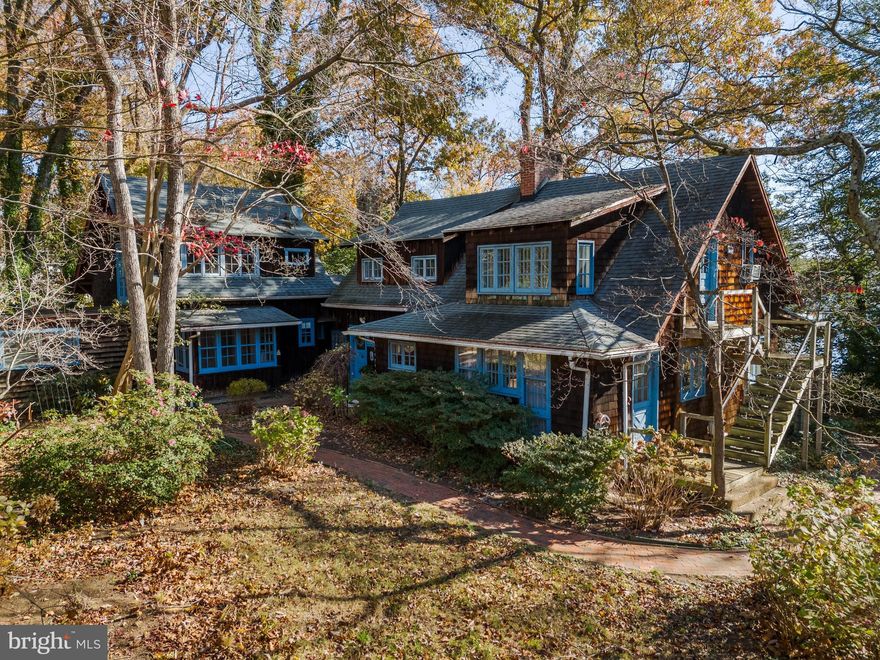 *WELCOME TO HOPTOAD HOUSE* a charming and unique waterfront home brimming with unmatched charm, character and available for the first time in over 4 decades. This stunning property offers a perfect blend of classic and contemporary features, making it an ideal haven for those seeking a cozy and inviting retreat.
The main level boasts a large eat-in kitchen, complete with butcher block counters, an antique coal stove, and knotty pine cabinets, providing a warm and rustic feel. The formal dining room with a brick fireplace is a highlight, featuring a dramatic six-foot circular window  framed into a custom, handcrafted wood accent wall, creating a  stunning architectural focal point that showcases exceptional craftmanship and timeless design. The spacious family room, with its fireplace and built-in bookcases, provides a perfect spot for relaxation. Adjacent to the family room is a bright sunroom that leads to a large deck, partially covered, perfect for outdoor entertaining.
This level also includes two charming bedrooms. The owners suite offers a sitting room and a spacious closet. The other bedroom features a cozy fireplace and a custom built-in canopy bed, adding an extra touch of uniqueness. Additionally, there is one full and one-half bath on this floor, ensuring convenience for residents and guests alike.
The upper level has two separate sections that do not connect, ensuring privacy and separation between the different areas. This thoughtful design enhances the functionality of the space and provides distinct areas for different needs and guests.
In one section, you'll find two bedrooms and a full bath, providing ample space for family and guests. Additionally, in the second area you will find a in-law suite with 2-bedrooms a full bath, cozy kitchen complete with stove, refrigerator, sink and ample storage space. This suite has a separate entrance from inside the home and another exit that leads down a stairwell outside the home, offering privacy and flexibility for extended family or guests.
The outdoor space of HopToad House is just as impressive. The property includes a pier with electric nearby and a brick-paved patio area near the water, which can easily be transformed into an outdoor kitchen. Brick walkways wind around the house, adding to its charm. A small boat ramp leads to double doors that open into the unfinished basement, which houses a woodburning fireplace and a storage room that could be a wine cellar—perfect for future customization and expansion.
A very large detached garage with electric provides endless possibilities for the car or boat buff.  The upper level of the garage provides ample space for an artist's studio, workspace, or flex space, catering to various needs and activities. According to an old newspaper article, the previous owner built a 37-foot sailboat in this garage, showcasing its impressive size and versatility.
HopToad House is not just a home; it's a lifestyle. With its distinctive features and prime waterfront location, it offers endless possibilities for comfortable living and entertaining. Don't miss the chance to own this one-of-a-kind property. This charming and amazing home is waiting for someone to give it the love and TLC it needs and bring it back to its former glory.  Schedule your visit today and experience all that HopToad House has to offer! Home sold As Is. Amount of Waterfront feet was obtained from plat.
Buyer to verify all information
PUBLIC WATER AND SEWER RECENTLY HOOKED UP!
IMPORTANT-DO NOT DRIVE ON OR ENTER PROPERTY WITHOUT PERMISSION!! YOU CAN NOT SEE THE HOUSE FROM THE ROAD. DO NOT ENTER WITH OUT A REALTOR AND YOUR REALTOR SCHEDULING AN APPOINTMENT. NO SIGN ON PROPERTY