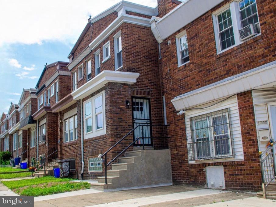 Move-in ready and fully renovated 4-bedroom, 2-bathroom townhouse located in the Lower Northeast/Frankford section of Philadelphia. This home features a spacious open-concept living and dining area, a modern kitchen with white shaker cabinets, subway tile backsplash, stainless steel appliances, and black matte hardware. The bathrooms are beautifully updated with contemporary tile and fixtures, including a stand-up shower with floor-to-ceiling tile. Enjoy peace of mind with all-new systems, including a brand new roof, HVAC, and water heater. The fully finished basement includes a full bathroom, fourth bedroom, private entrance, and washer/dryer hookup—offering the flexibility to convert it into a studio or in-law suite. Additional laundry hookup is available on the upper level. Step outside to a private concrete rear yard with private parking, perfect for entertaining or relaxing. Conveniently located on a quiet two-way street, just minutes from public transportation, local shops, and schools. A perfect blend of comfort, value, and convenience—schedule your showing today!