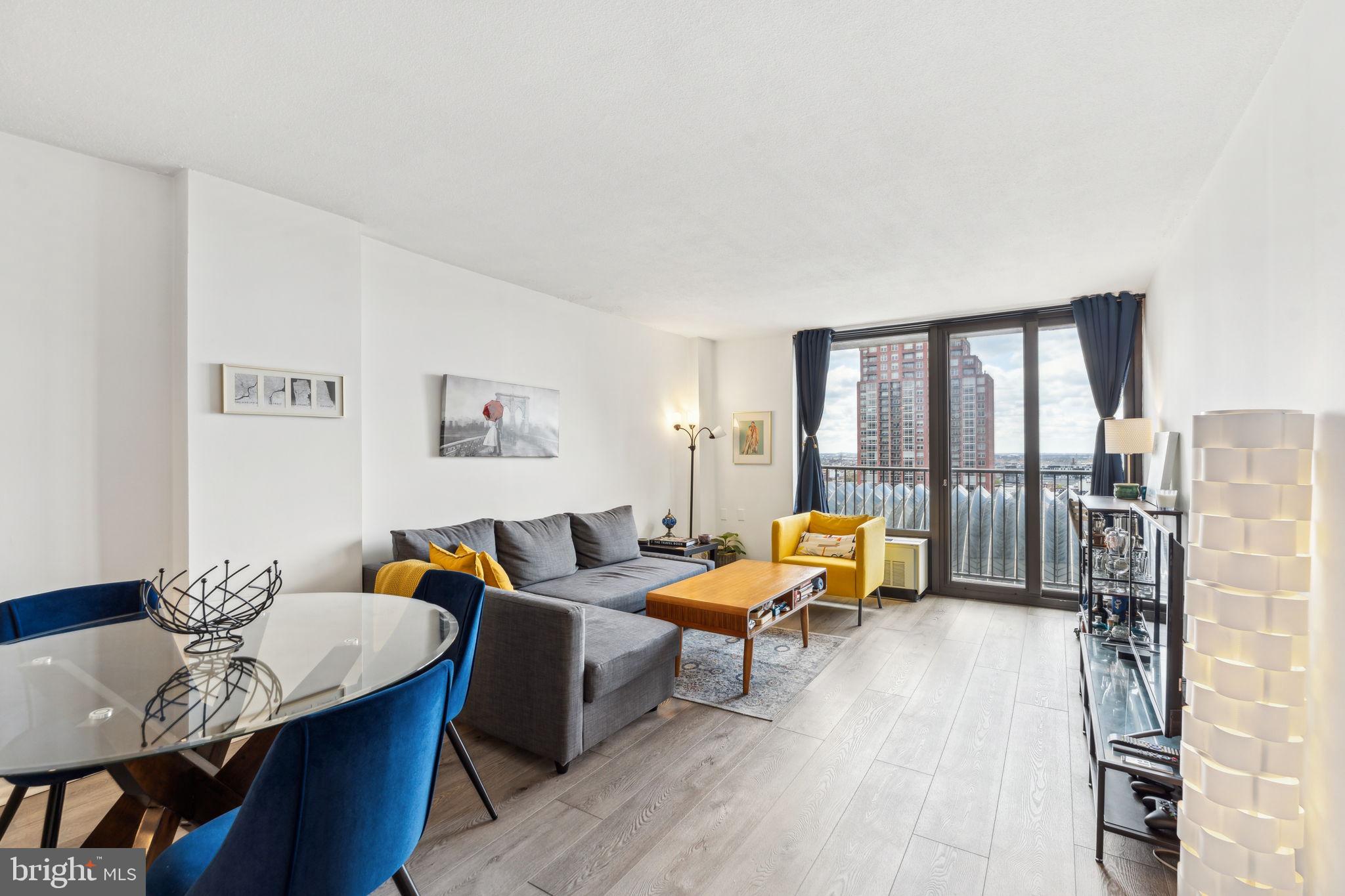 Fully renovated one bedroom with a French balcony boasting southern city views at Academy House. This south-facing home features modern finishes, an updated kitchen and bathroom, beautiful natural light, and vinyl floors throughout. Enter through the foyer with coat closet into the light-filled great room with open living/dining room and kitchen, perfect for entertaining. The living space offers access to the French balcony overlooking southern Philadelphia. The fully updated kitchen boasts dark shaker cabinetry, white quartz countertops, white tile backsplash, stainless steel dishwasher and oven with electric range and hood, black Galanz fridge, recessed lighting and an island with additional cabinetry and breakfast bar. The spacious bedroom has an oversized window, wall closet, and large walk-in closet. Adjacent is the brand new modern bathroom featuring a sleek gray vanity, light up mirror, walk-in shower with designer tilework, tile floor, and laundry closet with stacked washer/dryer. There is excellent closet space throughout. Residents of Academy House enjoy a 24-hour doorman and a state-of-the-art fitness and aquatic center. There is valet parking in the building's garage for an additional monthly fee, subject to availability. The Academy House is located in the heart of Center City and within close walking distance to Rittenhouse Square, Washington Square, and the Broad Street and Market Street office corridors. The Philadelphia International Airport and Amtrak's 30th Street Station are easily accessible.