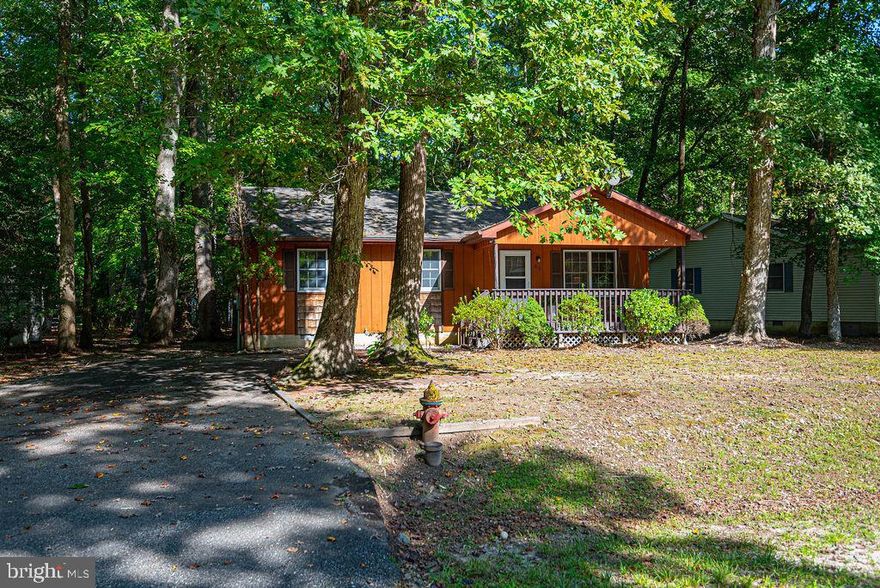 This Ranch Home is very convenient to the North Entrance of Ocean Pines, and is just a few steps from  Whisper Park! All spruced up and ready for you!  Fresh interior Paint, Brand new carpet and Luxury Vinyl Plank flooring.  New Roof in 2023.  Extra large Primary Bedroom. Enjoy the outdoors on the large covered Front Porch with swing,  on the Rear Deck or the Screened Porch brightened by 2 skylights!  Located in the Award Winning Ocean Pines community!