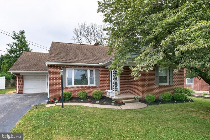 Adorable solid brick 1 1/2 story cape cod home with farmland view. 3 bedrooms 2 full baths. Brand new 2nd floor with 3rd bedroom, office, and tile bathroom. Eat-in country kitchen with pantry and all appliances. 2 bedrooms and tile bath on 1st floor. Large living room. New tilt in windows. Garage, workshop in lower level. Nice backyard with mature shade trees,  Front porch, Affordable single home in Manheim Central.