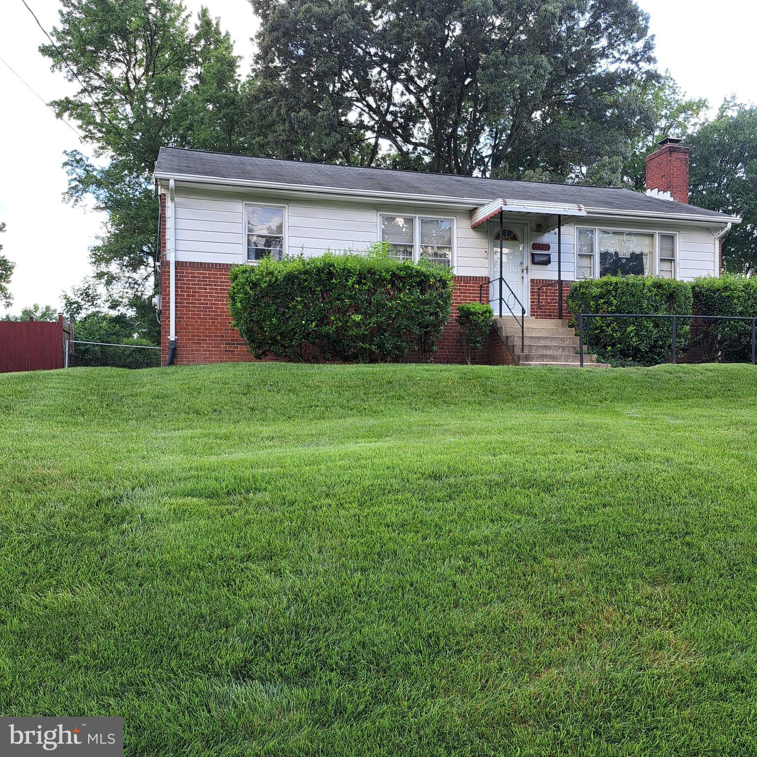 This solid brick rambler home with a basement has 3 bedrooms, 2 full baths .
It is move in ready or ready for your updates. Home sits on a nice sized yard in a neighborhood close to shopping, places of worship , hospital , schools, transportation hubs and more. Off street parking is available. No HOA, no extra monthly fees.
Easy commute to NASA, University of Maryland; less than a mile to MARC rail station and bus ; close to New Carrollton metro.
This home features a screened in temperature controlled porch and a deck with handicap accessible ramp access. There is wood burning fireplace in the living room, separate dining area and off street parking.
Finished basement area with full bathroom, separate entrance, laundry room, storage , utility room, rec room and much more. Or, reconfigure for income producing space.
Seller is offering a 1 year buyer home warranty.