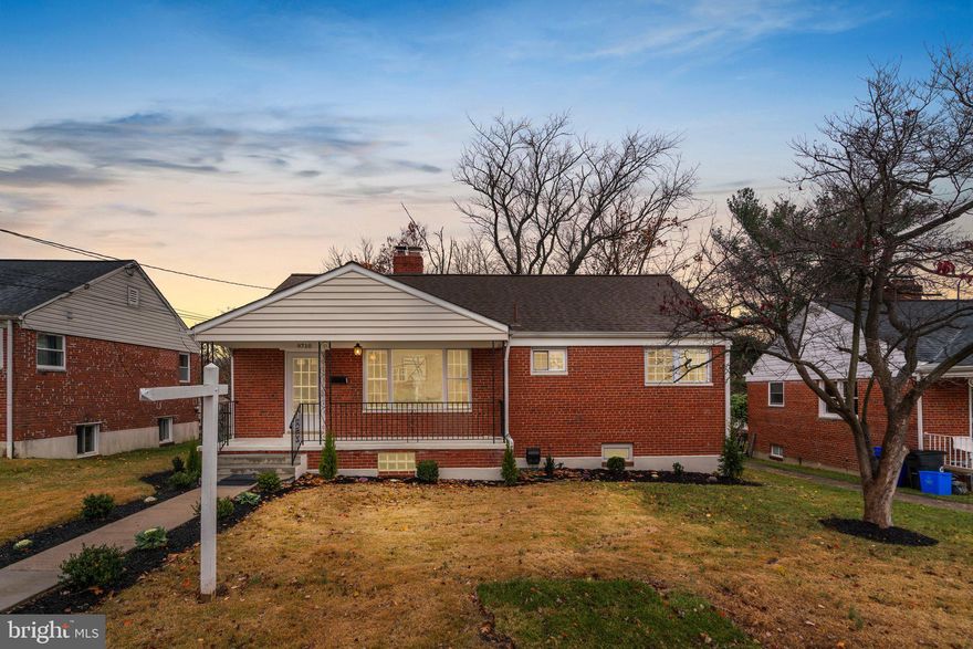 Professionally renovated and sun-filled home with 5 LEGAL bedrooms, instant access to I-495 and commerce, and just minutes to the DC line.  Freshly painted, newly landscaped, with a newer roof and gutters, tankless water heater, an entirely new kitchen featuring new tile flooring, granite countertops, brand new appliances, shaker cabinets, and subway tile backsplash.  The main living and dining areas include true hardwood floors,  recessed lighting, and a beautiful brick fireplace.  The newly remodeled basement features two large legal bedrooms, a new full bathroom, and flooring.