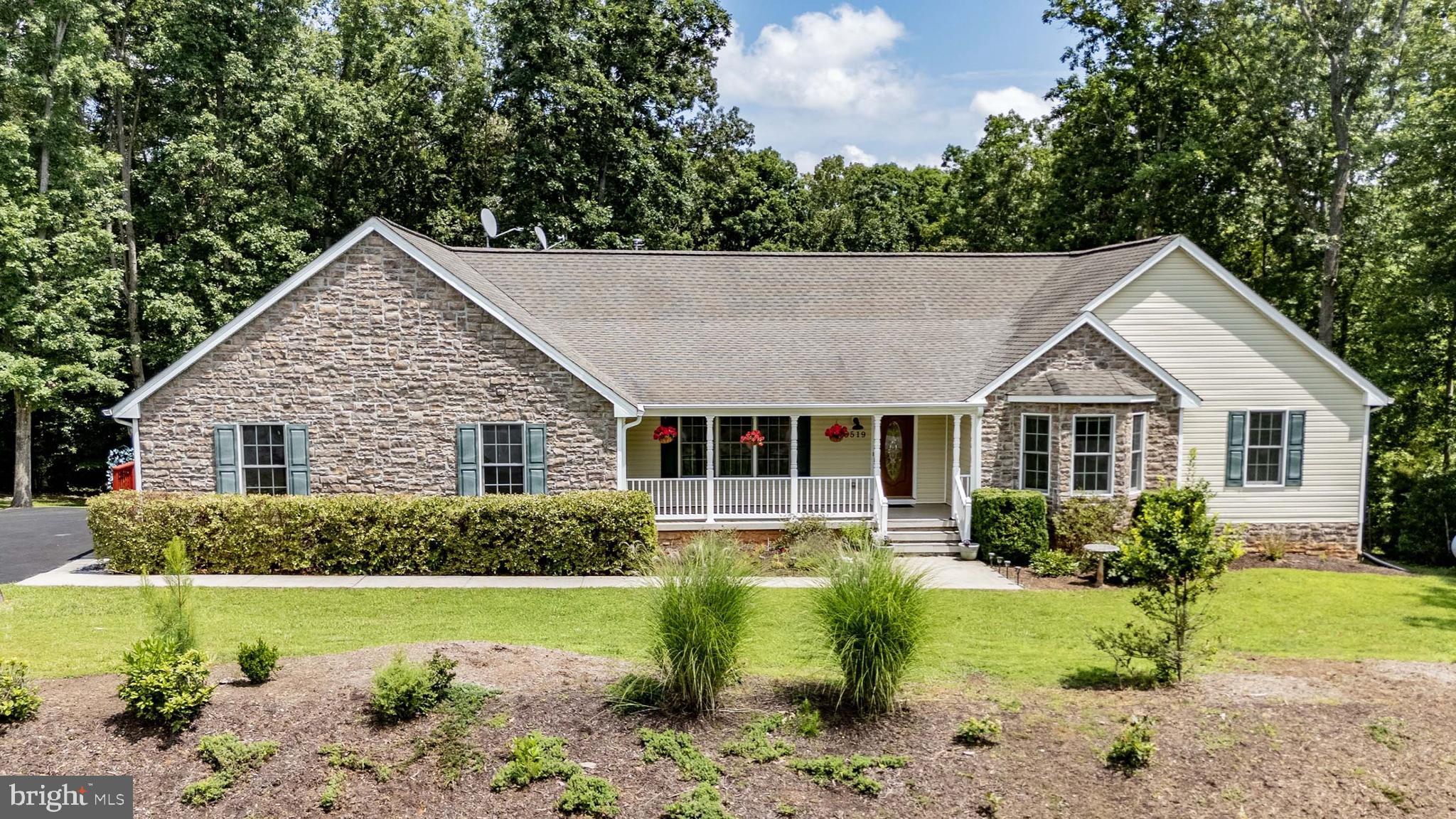 Lake Anna life, flexibility, and space — all in one! This lake access home in the desirable Wyndemere community on the public side of Lake Anna offers the perfect mix of everyday comfort and weekend retreat. With over 4,600 finished square feet, a main-level primary suite and a fully finished walkout basement complete with its own kitchen, living space and laundry, this home is full of possibilities.
The main level features three spacious bedrooms, a Jack-and-Jill bathroom, a large primary suite with deck access and thoughtful features like a ramped entry, grab bars and wide, open living areas. Downstairs, the bright lower level offers two additional bedrooms, two full baths and a full kitchen with island and backsplash — perfect as an in-law/au pair suite, hosting guests and creating your own entertainment zone. Three bedroom conventional septic system. There's even a parking area and separate entrace for secondary housing options.
Set on over 2 acres, you've got privacy, wooded views and raised garden beds. The paved wraparound driveway has rear access and multiple outdoor spaces, including a large back yard, screened porch and expansive back deck. There's also an outdoor pizza oven and bee hive!
Wyndemere, a lake-access neighborhood on Lake Anna in Central Virginia, has three community waterfront areas (one with a boat ramp), picnic areas, tennis, pickleball and basketball courts, plus fiber optic internet and quick access to restaurants, gas stations and shopping.
Whether you’re looking for a second home, a comfortable full-time residence, an investment property or room to welcome friends and family — this one checks all the boxes.