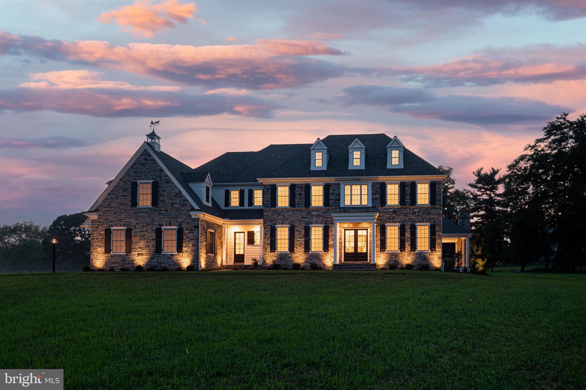 Every once in a while, a truly exceptional home comes to market and that time is now. Welcome to 32 Oakland Road, a new custom-built masterpiece in the Enclave at Chadds Ford by award-winning Hellings Builders. Privately tucked on 2.1 acres in one of the area's most prestigious settings, this home combines classic architecture, cutting-edge systems, and high-end finishes with a floor plan made for modern living.
From the moment you arrive, it’s clear no expense was spared. Step through the front door into over 7,000 square feet of living space filled with natural light, 10-foot ceilings on the main level, 9' on the second floor, site-finished white oak hardwoods throughout and an effortless flow between spaces. The formal living and dining rooms are found on either side of the foyer upon entry. The heart of the home is the chef’s kitchen, outfitted for the most discerning cook with a Sub-zero 36" refrigerator and 36" freezer, a Wolf French-top stove, two sinks, two dishwashers, a warming drawer, two refrigerator drawers, and a walk-in scullery with another sink and ample storage. Just off the kitchen is a command center-style message station—perfect for staying organized in your daily routine. An exceptionally spacious breakfast room leads to the patio while the family room offers a vaulted ceiling, gas-burning fireplace and hidden speakers and subwoofer in the drywall. A bedroom, full bath, powder room and mud room with the built-ins complete the main level.
Upstairs, the luxurious primary suite is a true retreat with vaulted ceilings, dual walk-in closets, and a spa-like bath complete with oversized shower, rain head and handheld sprayers, soaking tub, and two separate water closets. There is a bedroom with an en-suite bathroom and then two additional bedrooms share a spacious jack and jill bath. A large loft offers the perfect flex space—already roughed-in for a full bath. The laundry room completes this level with 2 washers and 2 dryers for the utmost laundry efficiency.
The finished lower level has 10' foundation walls, imported Italian tile that seamlessly matches the hardwood flooring above, and a custom-built maple bar (coming soon) fitted out with a sink, Viking dishwasher, GE Profile full-sized refrigerator and prepped with a 240kW outlet. The media area has hidden speakers and subwoofers installed behind the drywall for the ultimate high-tech auditory experience. This space is also prepped for a projection system (seller will be leaving the high-end projector equipment for future install). A full bath and washer/dryer hookup is located here as well. The basement has a glass door with steps up to the flat backyard.
Outside is a flagstone patio and covered porch with recessed lighting, ceiling fan, and stone fireplace which can be used as gas or wood-burning, inviting year-round enjoyment. Just a step down the flat backyard, there is plenty of usable space here to entertain, garden or just unwind and enjoy the sunset. The professionally landscaped front and rear flower beds are served by a drip irrigation system for easy maintenance.
Additional upgrades include a 20kW generator, water softening system, reverse osmosis system (purchased and ready for installation), wiring for 6 wireless access points, Closets by Design custom fit-outs in every closet, R-21 insulation and Certainteed Grand Manor shingles.
Located in the top-ranked Unionville-Chadds Ford School District and just minutes from downtown West Chester and Route 202 with easy access to Delaware and I-95. This home offers an unmatched combination of location, luxury, and livability. You truly have to see it in person to appreciate the level of craftsmanship and thoughtful design that make 32 Oakland Road one of a kind and only available due to relocation. ** Please note property is new and taxes have not been determined.