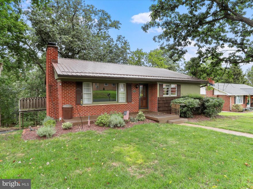 Welcome to 807 Valley View Drive in LaVale! Perched atop the mountain where deer often roam, this home offers a peaceful retreat surrounded by nature. The main level features a spacious primary bedroom with a walk-in closet and private half bath, along with an additional bedroom and full bath. Underneath the carpeting, hardwood floors are waiting to be revealed.

The inviting living room boasts a cozy gas fireplace with large windows for great natural light, while the kitchen shines with granite countertops and comes fully equipped with appliances. Downstairs, the lower level offers a versatile family room, a bedroom/den, and abundant storage space.

Enjoy the convenience of a one-car built-in garage and additional driveway parking. The property rests on just over a half-acre lot, embraced by mature trees and natural beauty, providing a serene outdoor setting.

This LaVale home combines comfort, space, and the tranquility of mountain living—don’t miss your chance to make it yours!