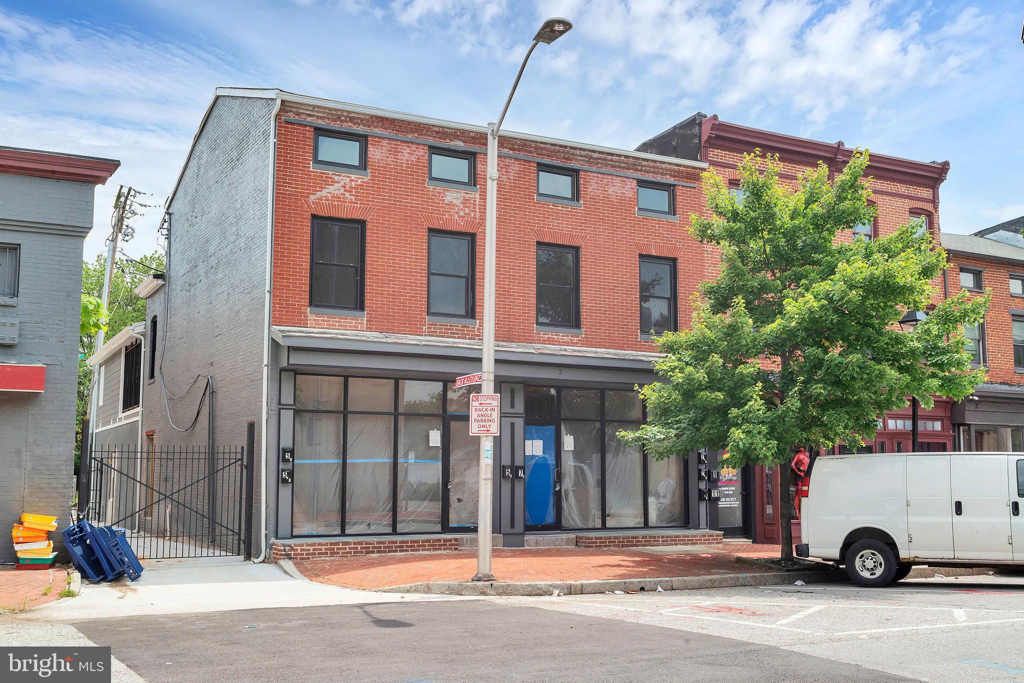 Unlock the potential of this exceptional mixed-use property in the heart of Baltimore City. Located at 5-7 S Carrollton Ave, this nearly completed building offers a rare chance to own a high-yield investment with significant upside. Featuring 2 commercial units and 4 modern apartments, this property is poised to deliver strong cash flow, as it will be sold fully rented with fully permitted use and occupancy certificates in place. This is a visionary investor’s dream! While the property awaits final BGE approval and sprinkler system installation, it presents a unique opportunity to acquire a nearly turnkey asset at a competitive price. The groundwork is laid, this property will shine as a premier income-generating asset in a vibrant, up-and-coming neighborhood. The commercial units are ideal for businesses seeking high-visibility storefronts, while the apartments cater to Baltimore’s growing demand for quality urban living. This builder has done numerous projects in the Hollins Market neighborhood, please feel free to ask about other projects and finishes, attached are a few.