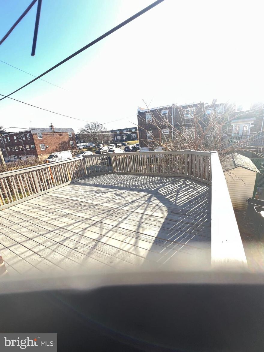 Welcome to this lovingly maintained home located in Mayfair. This home is the largest on the block and has many possibilities, and with a little love could be yours! This home has many features, original hard wood floors, high ceilings, central air, and ceiling fans. There is a large living room and dining room area; with open space that leads to an out door wooden deck. The eat-in kitchen has an abundance of beautiful oak cabinets, lots of counter space and fits a kitchen table perfectly! Located on the 2nd floor there are 3 large bedrooms, each with ample closet space perfect for storage. Outside of the home is a 1 car garage with driveway. Laundry room is located in basement and also offers more space for storage. Call today for showing and details, this great property won't last for long.