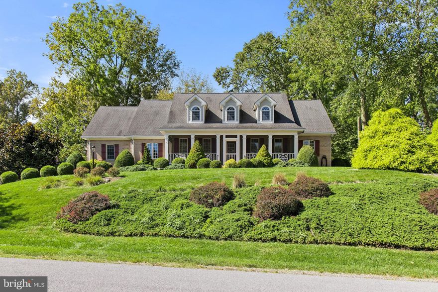 Exquisite Custom Built 4 Bedroom 3.5 Bath Cape Cod style home on the Golf Course. Golf and Country Club Community with many social activities, an 18 hole golf course, Restaurant, swimming pool and tennis Memberships available.  New Fabulous Screened in front porch to enjoy the golf course,  This home is a 3900 sq ft William Poole /Southern Living Design that features 10' ceilings throughout. 2 main floor bedrooms with separate bathrooms. The primary suite has a luxury bathroom with a gorgeous shower and dual sinks, Ceramic Tile. 2nd bedroom with a jetted bathtub/ shower and ceramic tile.  You will see quality as soon as you walk into the spacious foyer and see the open floor plan with many custom upgrades and hardwood flooring.  Large  Formal dining and a large living room with hardwood floors, a new gas fireplace are great for entertaining or relaxing by the fire. The gourmet kitchen features custom Mennonite cabinetry, quarts counters, double convection ovens and warming ovens along with a new refrigerator. There is a breakfast area/table space. Main floor laundry room with storage closet, Mennonite Cabinetry, laundry sink and Samsung washer and dryer. There are   2 additional bedrooms, full bath, work shop, 2 bonus rooms to work from home or to home school,  and Huge entertainment area are all located upstairs. The Entertainment Room  features reinforced flooring for the pool table, a gorgeous wood paneled surround fireplace and wet bar area.  Custom hardscaping with new Trex decking.  A 2 car garage with cabinetry and a sink are great for gardening. There are so many wonderful custom quality features inside and out! New Hot water Heater, and a Whole House Generator. Large Oversized Garage with lots of room. Gleisner Security System. Half-acre Lot. This is a must see.