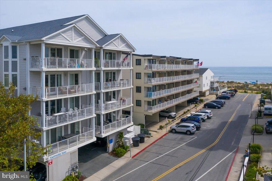 Striking 3BR/3.5BA ocean block two level townhome condo with breathtaking ocean views from inside the unit has just been listed!  If you are looking for a spacious (1,930 sqft) ocean block home at the beach this is the one.  It is a rarely available townhome in sought after Sapphire Seas, conveniently located on 35th street close to restaurants, shops and the boardwalk.  Take the elevator up to the third floor and open the door to your private beach retreat. On that level there is a large living area that has plenty of space for family and friends, and there is a fireplace for year-round enjoyment.  The kitchen is off that living area and has custom cabinets, granite countertops, tile flooring and plenty of storage space.  The dining area is off the kitchen making it the perfect place for enjoying family meals together.  On that first level you will find a master suite with private bath and there is an additional half bath on this level as well.  There is also a large balcony for relaxing and enjoying cool ocean breezes.  Beautiful oak steps take you to the second level.   As you open the door to the second level master bedroom you will be greeted with expansive ocean views.  The master bedroom is oversized and has a luxurious bath.  You will love sitting on the deck off the bedroom while you enjoy your morning coffee.  The third bedroom is big as well and has a private bath. There is a home office, full-size laundry room, and beach storage closet on this level as well. There is a convenient exit door on this level that takes you to the 4th floor elevator.  This townhome has beach décor and comes furnished ready for your immediate enjoyment. You get two assigned parking spaces underneath the building.  The unit has been used as a second home, is not being rented, and is well maintained.   Heat pump replaced in 2019. A unit like this doesn't come up often!  Come take a look today before it's SOLD!