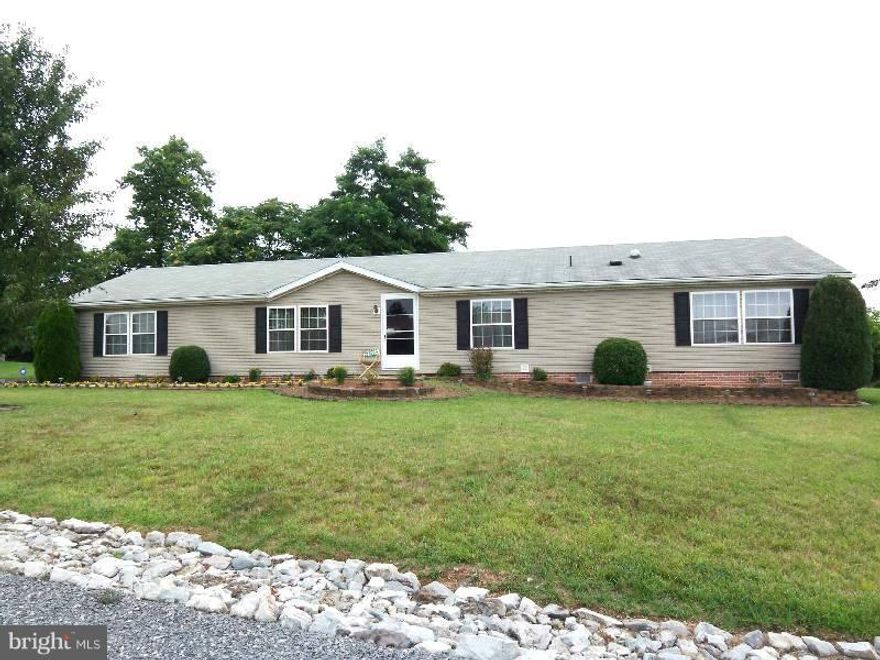 Well maintained manufactured home on permanent foundation features 3 bedrooms, 2 baths, office/den w/cabinets, spacious kitchen with skylights, pantry and breakfast bar, gas fireplace in family room, cathedral ceilings, master bath with double vanities, jetted tub and separate shower,  solar tube and mud room/breezeway connecting garage.  6' private fence and custom brick patio in backyard.