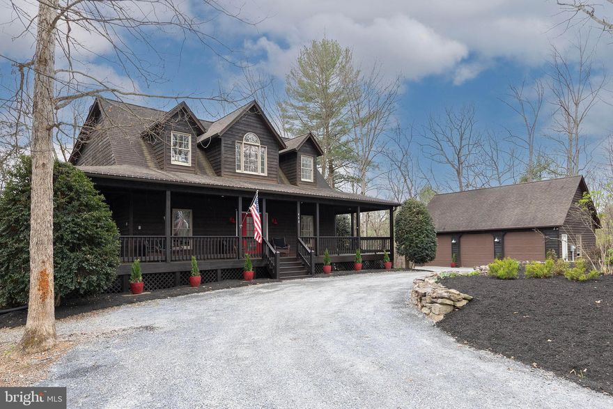 Nestled in the woods, this 6-bedroom, 3.5-bath retreat comes to market with heartfelt care from its current owners, who are relocating for school after creating a true haven designed to slow life down. With generous space for family, friends, and out-of-town guests, the property also features luxury outdoor kennels for four-legged companions, as well as two fully fenced acres.

Surrounded by nature, the home invites endless exploration beneath the trees, along winding wooded paths, and beside a seasonal creek. Quiet country roads for long walks in the fresh air, compliment the deck and front porch lending themselves as peaceful spots to unwind at the end of the day.

Inside, each room has been thoughtfully curated to support both comfort and creativity, from cozy reading nooks and piano moments to a tucked-away office space for working from home. A major 2023 renovation expanded the home’s livable space with a beautifully finished 1,100-square-foot basement, adding two additional bedrooms, a full bath, a dedicated home office, and a spacious living area anchored by a cozy gas fireplace, easily activated at the click of a button. Entertaining is effortless with a stylish basement bar, while ample storage space has been thoughtfully preserved, including room for a functional workshop.

On winter days, the lower level opens to a snowy, light-lined slope that becomes a magical sledding hill, while in warmer months the home continues to shine as a gathering place. Summer nights are best spent around the backwoods fire pit under dark skies, enjoying bonfires, music, and the simple beauty of the setting. This is more than a home it is a place of respite, recreation, and memory-making, and one that will be deeply missed.

For added peace of mind, a full list of recent upgrades is available upon request, highlighting significant investments in the home’s long-term comfort and reliability, including new carpet in all bedrooms, a whole-house generator, Starlink internet, a new furnace installed in Fall 2025, and a brand-new roof being installed in April 2026 that carries a 20-year transferable warranty.