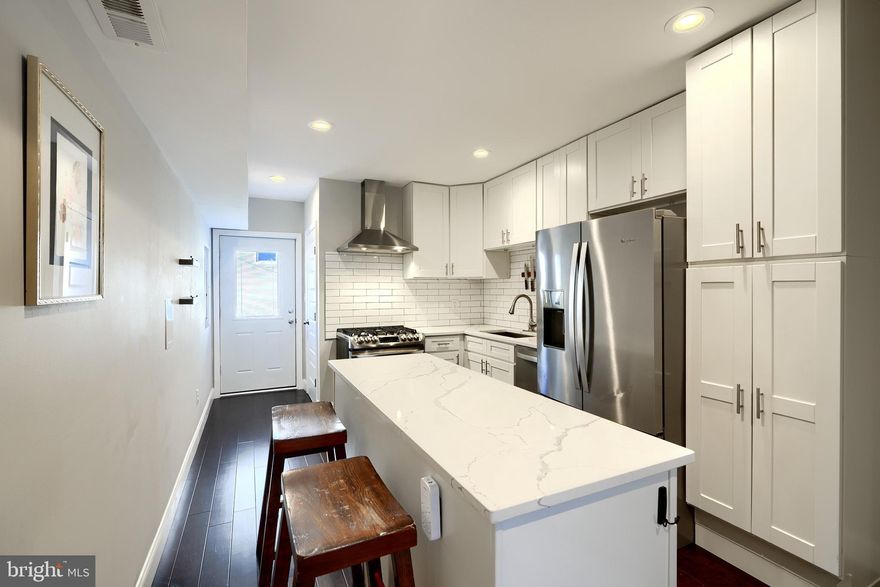 Welcome to 1404 Towson St, a remarkable CHAP renovation that will save you thousands on your taxes! Renovated in 2020, this 3bd/2.5ba home offers an open floor plan, rooftop deck, updated kitchen and tons of storage space. Buyers are greeted with hardwood floors that flow throughout the entirety of the main level. The living room is accented by an original fireplace, exposed brick and historical trim. The open floor plan flows nicely into the kitchen, which is perfect for entertaining guests. Equipped with a dual-fuel convection range, this kitchen will please any home chef! Additional amenities include stainless steel appliances, quartz countertops, a tile backsplash and soft-close cabinets. There's also access to the rear patio, which is perfect for entertaining guests and offers the potential for parking if the utility pole is moved. The main level is completed by the powder room, which is convenient for guests. Upstairs offers a spare bedroom with hardwood floors and a spacious closet, and a guest bathroom in the hallway, which offers a shower/tub combo with subway tile and a nice for storage. Laundry is also available on the upper level for added convenience. The primary suite offers exposed brick, hardwood floors and an ensuite bathroom with stall shower. There is also access to the rooftop deck, which offers panoramic views of Baltimore and a direct shot of Fourth of July fireworks! The home is completed with a finished basement that is great for additional living space or a third bedroom and offers ample storage. If you want to live in the heart of all of the action in Locust Point, look no further than 1404 Towson St!