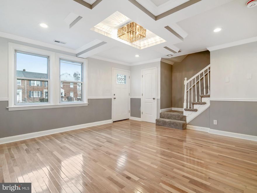 Come see this beautiful new rehabbed home. Everything is brand new. Hardwood flooring throughout the main level. Stainless steel and granite in your kitchen. New bathrooms, plus a fully finished basement with bar and full bath. Parking is around back and plenty of it!!