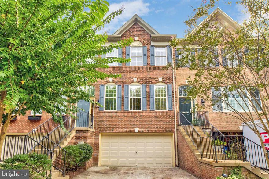 BACK ON THE MARKET! In this secluded gated community you are minutes to Old Town Alexandria with shopping, restaurants, nightlife, Whole Foods, and your choice of four Metro Stations within 5 miles. This grand-gem of a three story brick-front interior unit town-home comes with a two-car garage and has been remodeled by a master craftsman to resemble a historic American colonial home. The slate blue painted kitchen cabinets and island, granite counter tops, plank floors made of reclaimed heart pine originally harvested two hundred years ago, elegant crown molding, shadow box wall wainscoting throughout the freshly painted open concept main floor, stair wells and upstairs hallway and crossetted family room fireplace over-mantel take you back in time but with all of the convenience of a modern build.  The backyard from the newly carpeted first floor allows for easy access to a fenced area backing to mature trees through a new sliding glass door.  On the second and main level, there is a formal living room area, and a rear family room area with an enclosed gas log fireplace.  Off the family room there is an oversized deck that is accessed through another new sliding glass door allowing for grilling, entertaining, and enjoying the privacy afforded by the canopy of an old growth of trees that separates the community from the surrounding neighborhood.  The third floor primary suite boasts soaring ceilings with ample space included in the builders upgrade bump-outs for a contemplation area or a private relaxation space for watching movies or reading.  The primary bathroom again has a soaring vaulted ceiling, a stand-alone shower, double vanity, and oversized corner bathtub.  The third floor laundry area is conveniently located between the three upstairs bedrooms and the second full bathroom on the floor.  The basement is finished with a rough-in for a third full bathroom.  Out the front door and down to your private driveway you are greeted by the community’s lush landscape and another thicket of mature trees that shower you with colors in the fall.  With ample unassigned community parking having guests over to enjoy this immediate DC area oasis is a breeze.  This large town-home is walking distance to Cameron Elementary and Burgundy Farm Country Day School.  Easy access to the area’s commuter routes, your new home is a quick drive, or car service, to National Harbor, Downtown DC’s attractions, Amazon HQ2, the Pentagon, Fort Belvoir, Andrews Air Force Base, Joint Base Anacostia-Bolling, Capitol Hill, and the Washington Navy Yard.