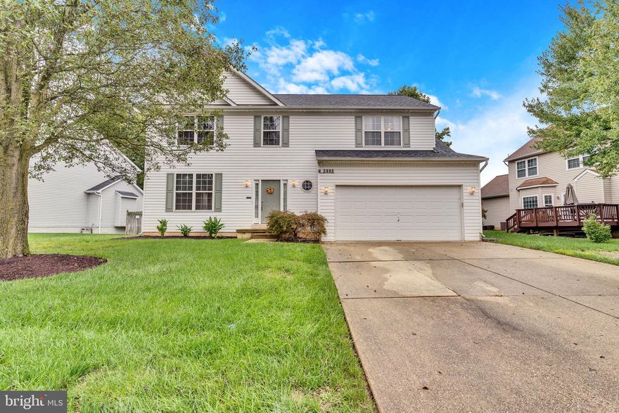 Welcome to 2332 Springdale Ln, a stunning Colonial with a two-car garage and recent updates! This spacious home features a natural gas HVAC system (replaced within the last five years), a newly installed commercial-grade gas hot water heater, and an inviting main level with hardwood floors, an island kitchen with stainless steel appliances, and a cozy family room with a gas fireplace. The upper level offers four bedrooms, including a luxurious owner’s suite with a cathedral ceiling, dual vanities, soaking tub, and a step-in shower. Enjoy outdoor living with a huge deck, privacy-fenced backyard, and plenty of room for kids to play. TVs throughout the property convey, making this move-in ready home a true gem!