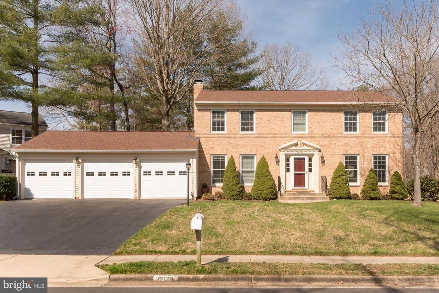 Beautiful brick-front colonial in sought after Lake Ridge! Featuring an updated kitchen with gas cooking, new stainless steel appliances, and granite counters. The kitchen opens to a comfortable and cozy family room with wood burning fireplace. French doors from the kitchen open to the back deck, making outdoor entertaining a breeze! The THREE car garage is perfect for additional parking, a workshop, or extra storage. Boasting a gorgeous master suite on the upper level with an over-sized walk-in closet and luxuriously appointed master bathroom with spacious shower, soaking tub, and a skylight. Three additional bedrooms and full bathroom with double vanity complete the upper level. The finished basement with walk-up stairs is perfect for an additional family/recreation room and features a private sleeping room and full bathroom -- perfect for guests! Roof replaced with architectural shingles in 2016! Enjoy outdoor living on the spacious deck overlooking the large, newly (2018) fenced yard with fresh seeding & aeration. Garage storage equipment conveys. Less than a mile to community pool, playground, grocery store, Conveniently located to major roads, public transportation, shopping, dining, and recreation.