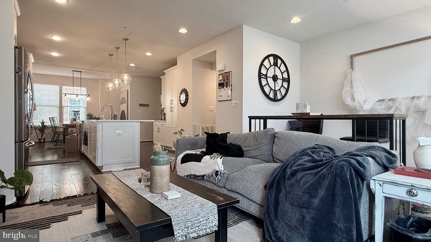 One of the largest model built in 2018 in Hampden Square (the Kingsley model with deluxe loft option) totaling over 2800 sqft. A move-in ready home in a great location, very convenient to I-85,  and so close to  the hip shopping area of The Avenue in Hampden.  Minutes from the world renowned Johns Hopkins,  the Baltimore Zoo,  and across from the library and the park. All these amenities with an attached rear entry two-car garage with recessed lighting. The home is in impeccable condition with custom upgrades throughout  with newly replaced 4th floor HVAC (10/2024), new dishwasher and refrigerator (in 08/2021). This home has a total of four bedrooms and 4 full baths and 1 half bath (water closet in every floor). The main entry is on the first floor with the garage, full bathroom and a bedroom with a walk-in closet (which can be used for office). The gourmet kitchen is on the next floor up, with a large island for entertaining with plenty of cabinets and pantry for storage. A formal dining area is enough to fit a large table with living/family room and half bath on the same floor. Two primary bedrooms on the next floor each with full bathroom (with double vanity) and a walk-in closet. The laundry and linen closet are also on this 3rd floor. There is an additional bedroom with full bath on the top 4th floor with potential wet bar or kitchenette (plumbing installed) with a full bathroom and another bedroom that can be used for private study or office. The entre 4th floor can be used for family, media, or exercise room that leads to the 4th floor roof deck. Plenty of natural lights throughout the day in every single room!