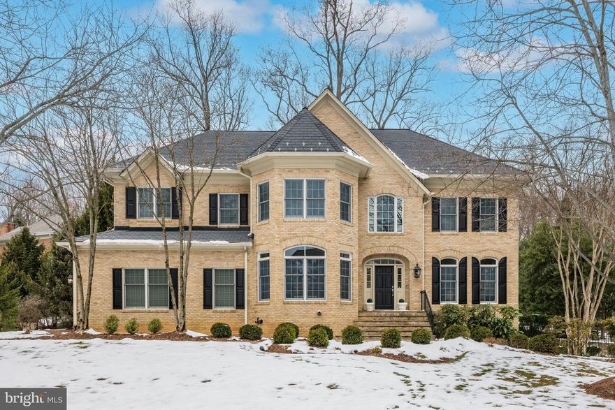 Welcome to Rapley Preserve,  the sought after gated community within Avenel in Potomac.
This custom colonial offers expansive rooms throughout, perfect for entertaining and everyday living.
The main level welcomes you with a two story foyer, spacious living room and dining room, library with adjacent full bath,  fabulous large kitchen with table space for 12, a spacious outdoor deck , and two story family room with adjacent powder room.   The family room hallway leads to a mudroom and two car garage.  
The circular staircase leads up to the bedroom level, offering a spacious primary suite with primary bath,
three additional bedrooms, two additional baths and a loft that overlooks the family room and provides
a back staircase down to the kitchen.   The light filled lower level is delightful, offering a 5th bedroom and bath, large recreation room used as a theatre room, a huge gym room that can be used as either a gym or pool table room, etc.   Ample storage is provided for throughout the home.  Avenel provides landscape maintenance, swim and tennis membership and private surveillance all included in the HOA fee.