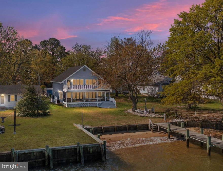 The STUNNING CHESTER RIVER VIEWS and AMAZING SUNSETS will keep you falling in love with this Immaculate, Well Maintained & Upgraded Home in the Private Community of Chester River Beach! This Waterfront Gem has its very own PRIVATE BEACH... a Priceless Value indeed! As you enter, you are greeted with a 2-Story Wall of windows that seamlessly meld the Great Room with the Waterfront setting... a back drop that will ALWAYS remain! Get ready to be wowed with all NEW Ceramic Tile Flooring throughout the main level, Neutral Paint and an Open Floor Plan which is Perfect for hosting all the FUN EVENTS!  Updated Kitchen boasts sprawling Granite Countertops, Stainless Steel Appliances and high-quality Custom Cabinetry that are all sure to please. You can even wash your dishes while looking at the Water! The impressive 2-Story Great Room offers tons of natural light, 2 ceiling fans, gorgeous knotty pine ceilings and a Gas Fireplace for cozy nights.  Main Level Bedroom with new hardwood floors and a full bath make it nice to enjoy one level living if needed. Upstairs you will find gleaming hardwoods floors throughout, 2 large bedrooms, full bath with ceramic tile floors and upper level deck to maximize those breathtaking views! Take in all the Beauty and Chester River Views from the rear Screened-in-Porch, complete with ceiling fans for the warm days of Summer while enjoying Crab Feasts & company! Lots of storage with pull down Attic and Large Outbuilding with electric. The Landscape and Hardscape have been thoughtfully done to give peace of mind with living on the Water.  Enjoy the 50 feet of Shoreline, the Sandy Beach, Panoramic Waterviews and an astounding Nature Scenery, to include Osprey, Blue Herons, Sea Gulls, Bald Eagles and even Dolphins! Get ready to Crab & Fish right from your very own Pier, take in the Sunrise and the Sunset and hop on your boat that can be docked on the Boat lift- what more can you ask for! Whether you are kayaking or taking a paddle on your SUP, there is always something special to do on the water. Enjoy Boat rides to the Narrows, Corsica River, Chestertown, Rock Hall, the Eastern Bay and St. Michael’s! Hit the Dock Bars, Seafood Restaurants and all the Shopping your heart can handle! Come live the Shore Life, the way it was meant to be lived! Put this one on your MUST SEE list... she is pretty special and will not disappoint!