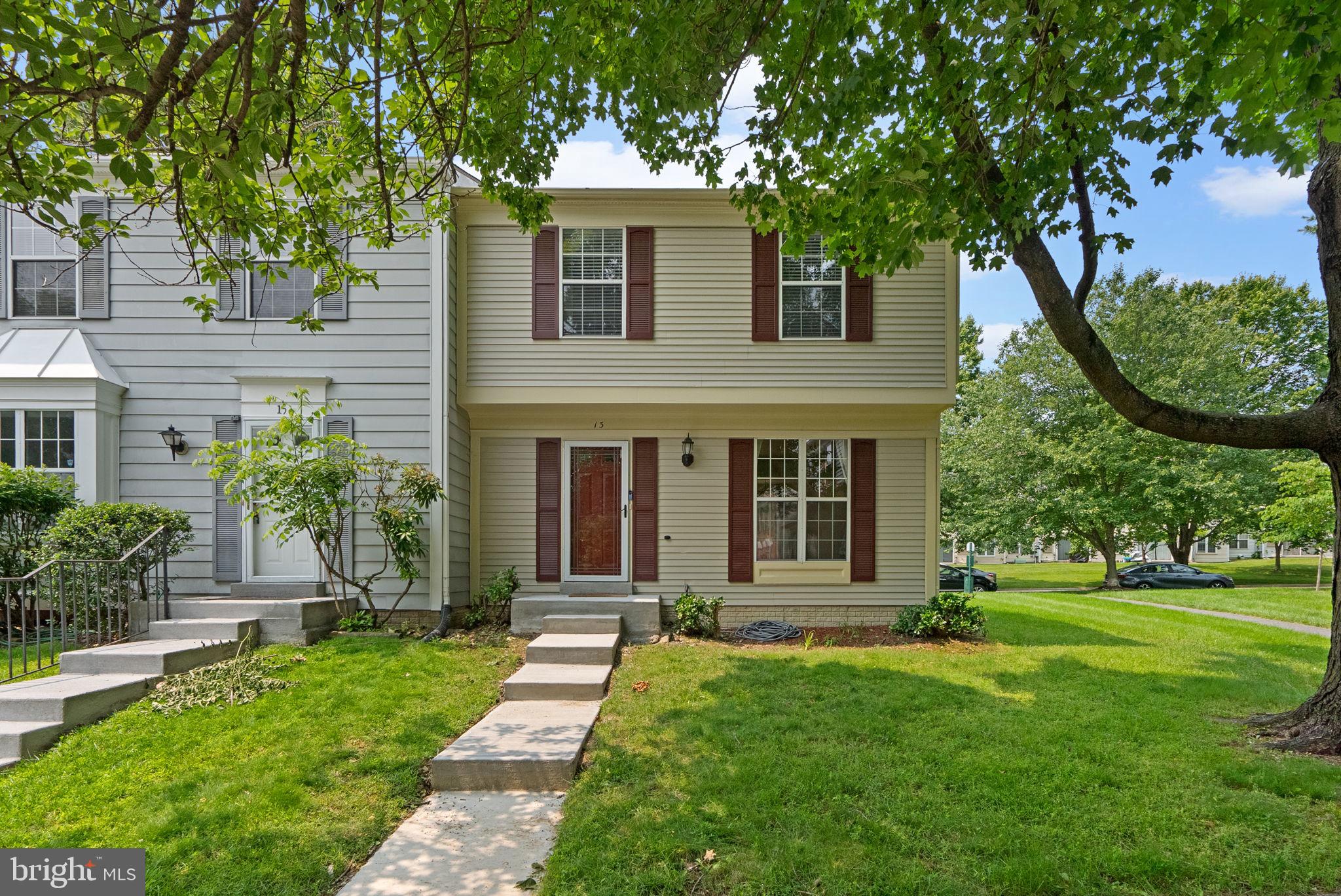 Well-maintained end-of-row townhouse offering 1,588 square feet, 3 bedrooms, 2 full baths, and 1 half bath for rent in desirable Longmead. The entry-level features a traditional layout beginning with a welcoming foyer and a convenient powder room. Hardwood floors flow through the spacious formal living and dining rooms, where a sliding glass door provides direct access to the fully fenced backyard and patio—ideal for relaxing or entertaining. The adjacent eat-in kitchen is equipped with stainless steel appliances, rich cabinetry, ample counter space, a mosaic tile backsplash, and a pantry for added storage. Upstairs, you'll find three carpeted bedrooms and two full bathrooms, including the comfortable primary suite with a private ensuite bath. The finished lower level offers a versatile recreation room, perfect for a home office, play area, or media room, along with a dedicated laundry area for added convenience. This home includes two assigned parking spaces and is ideally located near neighborhood amenities, commuter routes, and everyday conveniences.
