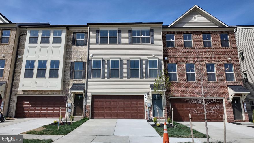 Located at 16617 Aruba Drive in the Manning Square community, this newly constructed Patuxent townhome offers a thoughtfully designed open layout with modern finishes throughout. The home features a welcoming front elevation with covered entry, a finished lower‑level recreation room with storage area and full bath, and direct garage access for added convenience. 

The main living level includes  kitchen with upgraded stone countertops, stainless steel appliances, and single‑bowl sink. The kitchen flows seamlessly into the living area highlighted by a built‑in electric fireplace. Upstairs, the primary suite includes a private en‑suite bathroom and walk-in closet. Oak staircases connect all levels. A comprehensive builder warranty allow for additional peace of mind. Interior photos are of a similar plan and are for representation only. For more information, please contact Caruso Homes directly.