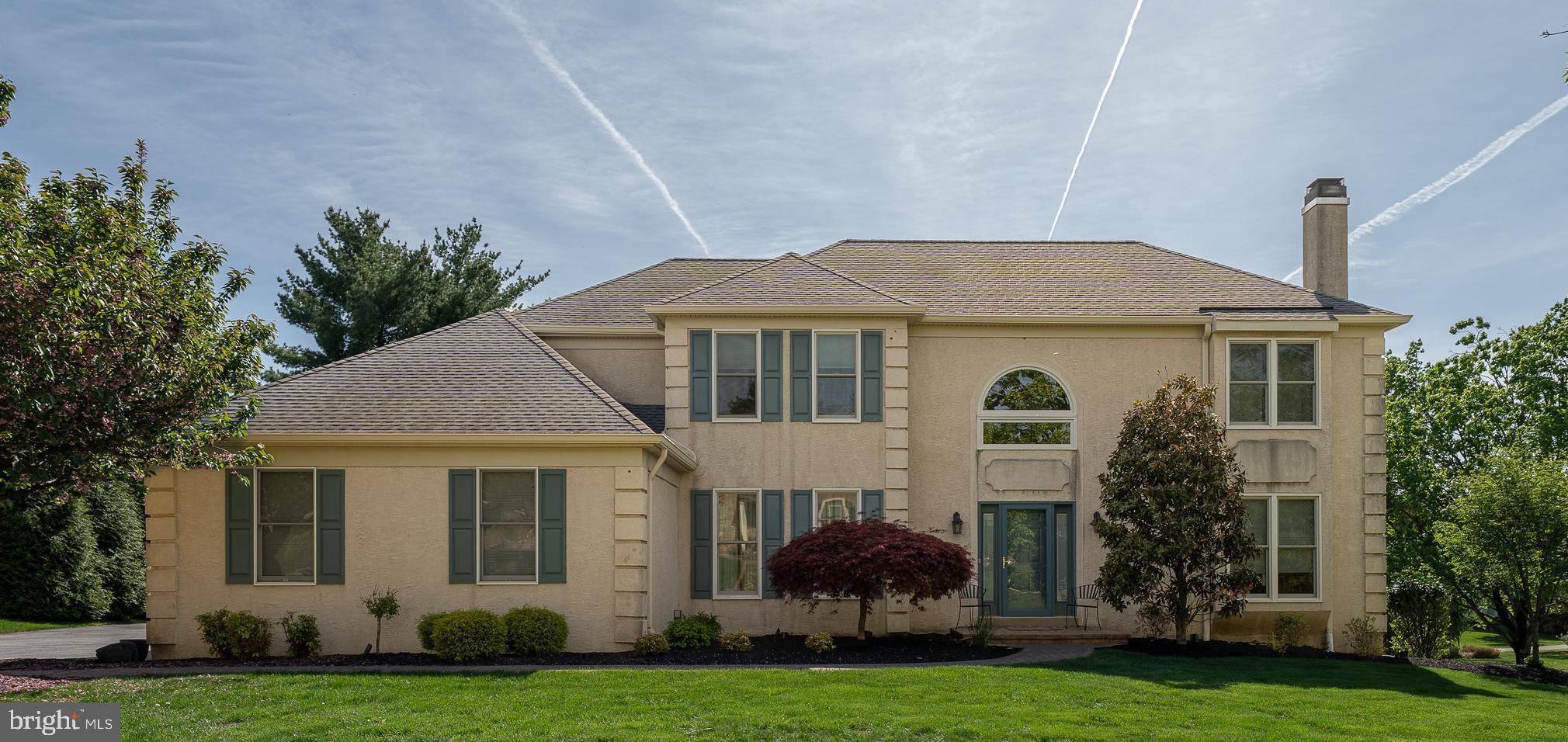 Welcome to 1 Rockhill Drive, a beautifully maintained 4-bedroom, 2.5-bath home with over 3,400 square feet of above-grade living space in the highly sought-after Cedar Grove Farms neighborhood of Broomall, Marple Township. A paver walkway leads you into the soaring two-story foyer, setting the tone for the elegance found throughout the home. The main level offers a layout perfect for everyday living. The spacious formal living room features hardwood floors, a gas fireplace, recessed lighting, and crown molding. The formal dining room is accented with chair railing and crown molding, providing a lovely space for gatherings. The renovated eat-in kitchen is equipped with stainless steel appliances, upgraded countertops, an island, a custom tile backsplash, and a separate breakfast room with sliders that open to a Trex deck—ideal for entertaining or enjoying a quiet morning coffee. Off the kitchen, a mudroom/laundry area offers interior access to the 3-car attached garage. The cozy family room features a wood-burning fireplace, and sliding doors to the deck. A versatile office/study with double doors is also located on the main floor and can easily function as a guest room. Upstairs, the spacious primary suite includes two walk-in closets and a newly renovated en-suite bathroom with a corner jetted tub and a separate ceramic tile stall shower with glass surround. Three additional bedrooms with generous closet space share an updated hall bathroom. The finished basement provides over 1,200 sq ft of additional living that is perfect for entertaining along with two large storage rooms. This move-in ready home offers a perfect blend of warmth, elegance, and modern updates in one of Marple Newtown School District’s most desirable neighborhoods. Schedule your private tour today!