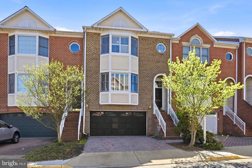 COMMUTER’S DREAM! Stunning all-brick townhome offering 2,521 sq. ft. of living space and the privacy of a desirable back-row location. This 3-bedroom, 3.5-bath home includes a 2-car garage and thoughtful upgrades throughout.
Enter to immediate views of an elegant curved staircase that sets the tone for this tasteful home. The spacious family room features a striking three-sided stacked-stone gas fireplace, seamlessly connecting the living and dining areas with warmth and style. The gourmet kitchen boasts white cabinetry, stainless steel appliances, new quartz countertops, and ample space for both casual dining and entertaining.  Main floor features hardwood. Step directly onto the deck from the kitchen—perfect for easy barbecuing and outdoor enjoyment.
Upstairs, the expansive primary suite impresses with vaulted ceilings and a beautiful en-suite bath. Two additional light-filled bedrooms, a renovated hall bath, and a conveniently located laundry area complete the upper level.
The finished lower level offers a cozy wood-burning brick fireplace, a full bath, and walk-out access to the patio—ideal for guests, a home office, or recreation space. 2-10's  SUPREME  Home Warranty Offered
Unbeatable commuters  location:  1 mile to the Tysons Silver Line, 2 miles to Dunn Loring Orange Line, and quick access to I-66 and I-495.