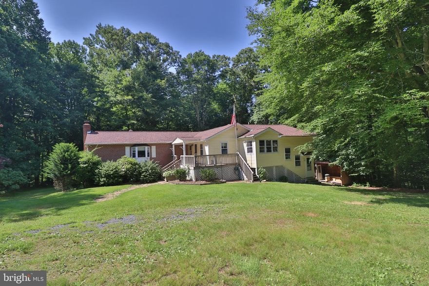 $$$ MONEY...SELLER will PAY CLOSING COSTS to help you Save some Money for new Carpet and adding your Own Touch to this FABULOUS Rancher.  1 Level Living with  approximately 3,000 Square Feet of Living Space in the Beautiful Brick and Siding 3 Bedroom and 3 Full Bath Home.  Sited on an Incredible 7 Acres with Plenty of Room for you to Create your own Little Farm....Animals; Gardens; Crops; Wood Harvesting; and, More!  A Pond for Fishing.  A stream for Fishing and Playing!  So Serene and Wildlife Abounds...Deer and Turkey All OVER!  100% Sustainable Living is Possible!  The Home has many Updates including Ark Roof; most Replacement Windows; Granite Counter Tops; and, MORE!  Jumbo 21 x 20 Master Suite with Sliders to a 14 x 12 Deck Overlooking the Woods.  Master Bath with Large Vanity and 2 Person Whirlpool Tub.  Main Level Family Room with Plenty of Windows Overlooking the Woods and access to Deck with Steps to Rear Yard.  Lower Level 25 x 20 Recreation Room with Wood Burning Fireplace and Brick Hearth and Surround and a Cool Looking Wood Stove.  Several Outbuildings.  Super Sized 36 x 20 Detached 3 Car Garage with Concrete Floor and Electric.  30 x 22 Barn Run-In with Room Above and Electric.  22 x 22 Barn with Lean to Shed attached.  Bring your Toys and Animals!  PEACE and QUIET...Deer and Turkeys...a Pond and Stream and Comcast Service await you on this Incredible 7+ Acre Oasis.