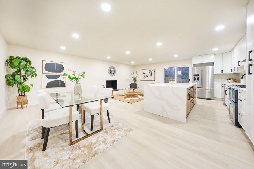 Fully renovated 3-level home with walkout basement and private ground-level entrance in the heart of McLean. No HOA. Located on over one-third of an acre in a quiet cul-de-sac within the highly sought-after Kent Gardens ES, Longfellow MS, and McLean HS pyramid.
This home has been completely reimagined in 2025 with a brand-new open-concept layout and extensive top-to-bottom renovations. The main level features a newly added primary suite with walk-in closet and luxury en-suite bath, designer powder room, and a gourmet kitchen with custom cabinetry, quartz countertops, high-end appliances, recessed lighting, and wide-plank luxury flooring throughout. New doors, railings, and fresh paint complete the modern interior.

Upper level offers two spacious bedrooms and a beautifully updated full bath. The fully finished walkout basement includes two additional bedrooms (each with window and closet), a full bath, bonus room ideal for office or recreation space, large wet bar with sink and cabinetry, second laundry area, and a separate private front entrance. The lower level offers excellent flexibility for extended family, guests, or potential rental use, presenting a strong opportunity for supplemental income (buyer to verify local requirements).

Major updates include all-new plumbing and electrical systems, new stucco and vinyl siding, new slate patio with outdoor fireplace, large storage shed, oversized two-car garage, and roof replaced in 2024 with transferable lifetime warranty.

Move-in ready with exceptional space, modern finishes, income potential, and versatile living options in a prime McLean location just minutes to shopping, dining, and commuter routes.