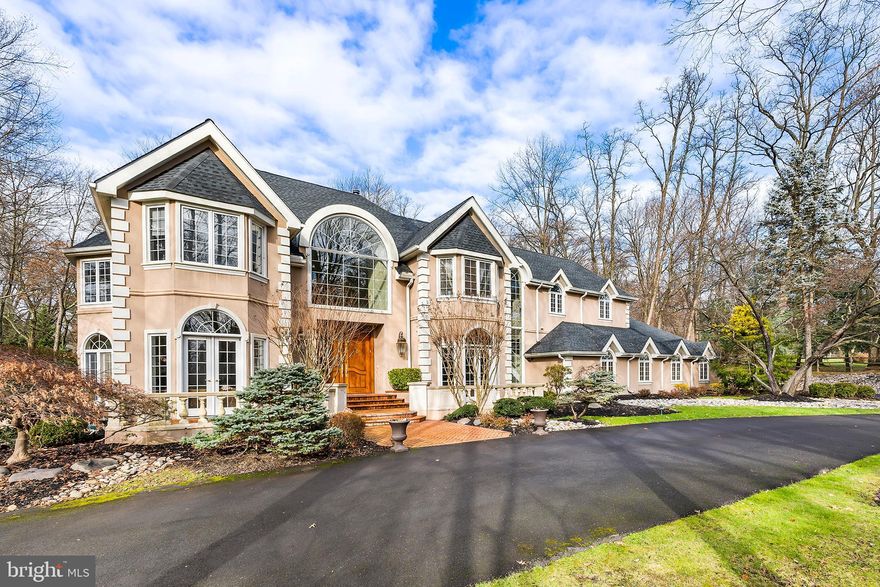 A true piece of art and  fresh to the market is this Custom built 8000 Sq ft home in Prestigious Pennock Woods, in Meadowbrook, Pa.  From the time you enter this home through the double ornate handmade wood doors, it will take your breath away entering the 2 Story Foyer with a Dual Sweeping stair cases, Elaborate moldings and Marble. If you are looking for a home that has character, individuality and great flow for everyday living and entertaining , you will love this home. The Great Room offers a 2 story setting, with fireplace and a Salon with full wet bar and Floor to ceiling windows looking over the private setting, lush Gardens and Patios. The Gourmet Kitchen offers State of the Art Appliances for any chefs' dream come true, again with an Eating area with Floor to Ceiling windows bringing the outdoors to the inside of the home. Main floor executive private cherry wood finished office space. On the main floor there is a formal living room, formal dining room and salon area with tons of windows and a wet bar. The Presidential Suite (Primary bedroom) in this home offers a fireplace and balconies for your retreats, dressing rooms, dual walk in closets, full Gym with sauna and steam room, plus a glamorous Bathroom with a sunken tub and Oversized Shower. There are 4 additional bedrooms between the 2nd and 3rd floor.  The laundry is located on the 2nd floor to make your laundry needs easier to handle. The lower level is finished with a bonus/office/bedroom and a full entertainment area for movies and game night.  As you arrive home each day enjoy the large circular driveway and attached over sized 3 car garage.  Professionally landscaped with exterior lighting, flowers and gardens, makes this home a true dream to enjoy.  Come take a tour of this destiny of a home and know you have arrived to your dream come true.