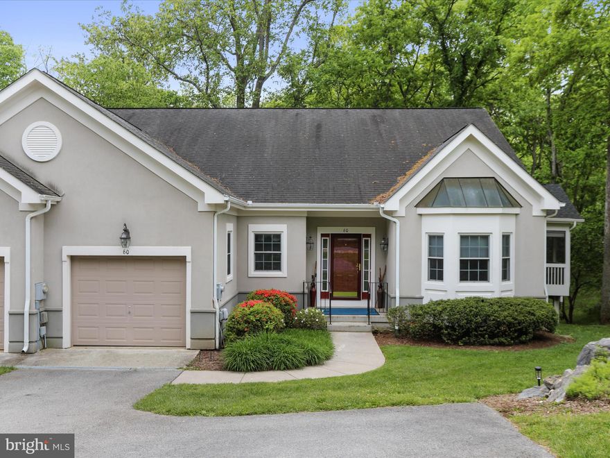 Refined One-Level Villa with Expansive Walk-Out Basement in Sought-After Cress Creek – 60 Reachcliff Dr, Shepherdstown.

Discover effortless elegance and peaceful living in this beautifully maintained villa, ideally situated on a private, landscaped lot in Shepherdstown’s prestigious Cress Creek golf community. Designed for ease and comfort, this home offers luxurious one-level living with the added bonus of a fully finished, walk-out basement—perfect for multi-generational living, entertaining, or extended stays.

The main level welcomes you with high ceilings, crown molding, and an open-concept layout that flows seamlessly from the great room to the dining area and out to the spacious deck and screened porch overlooking a serene wooded backdrop. A well-appointed kitchen features quartz countertops, stainless appliances, and ample cabinetry.

The primary suite provides a peaceful retreat with large windows, a walk-in closet, and a spa-like bath with dual vanities, soaking tub, and glass-enclosed shower. Additional flex spaces on the main level offer room for guests or a home office.

Downstairs, the expansive finished basement includes generous living space, storage, and direct access to the backyard. With high ceilings and abundant light, it’s ideal for a recreation room, guest suite, home gym, or studio.

Surrounded by mature landscaping and tucked into a quiet corner of the community, this home offers privacy without isolation. Enjoy access to Cress Creek amenities, scenic walking paths, and Shepherdstown’s vibrant downtown—just minutes away.

This is refined, turnkey living in one of West Virginia’s most desirable communities—perfect for the buyer seeking space, sophistication, and simplicity.