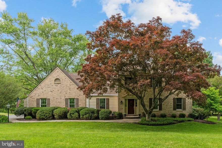 Welcome to 14020 Greencroft Lane, a beautifully maintained Colonial tucked away on nearly 2 acres in the sought-after Greencroft community. This 4-bedroom, 2.2-bath home offers over 2,900 square feet of finished living space, blending timeless character with modern comfort.

The heart of the home is the expansive eat-in kitchen, thoughtfully designed for both everyday living and entertaining. It features rich wood cabinetry, granite countertops, an oversized center island, and a dedicated breakfast area overlooking the backyard. A full suite of stainless steel appliances—including a wall oven, gas cooktop, built-in microwave, and French door refrigerator—makes meal prep a breeze, while recessed lighting and under-cabinet illumination enhance both style and functionality. The open flow into the adjacent family room with a cozy gas fireplace creates an inviting atmosphere for gathering.

The main level also includes a formal living and dining room, a large foyer, and convenient main-floor laundry. Upstairs, the primary suite features a private bath, while three additional spacious bedrooms provide flexibility for guests, work, or hobbies. The finished walkout lower level includes a generous game room, wet bar, and half bath—perfect for movie nights or entertaining.

Set in a serene setting that backs to mature trees and landscaping, this home belongs to a vibrant community offering a pool, clubhouse, and common area maintenance—all covered by the annual HOA fee. Located within the Dulaney High School district and convenient to local dining and recreational amenities, this is a rare opportunity to enjoy space, charm, and community living.