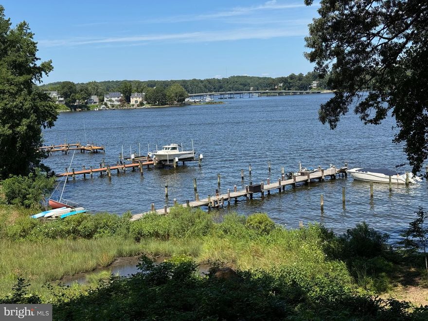 Nestled in the historic,serene waterfront community of Edgewater Beach, Shady Section, this home offers the best of what the Annapolis area has to offer — a short walk to multiple community beaches, scenic nature trails, and two private docks with available slips. This is where you will find your way home and not ever want to leave. Generations of owners will attest to this.
The timeless charm with this beautifully expanded 1940s cottage, perfectly blending classic character with modern updates defies photographic description - you must see it!
Imagine mornings on the front porch, greeting friendly neighbors, and evenings enjoying spectacular South River views from nearly every room. The open-concept layout is perfect for entertaining, featuring spacious, light-filled bedrooms and tastefully updated bathrooms.
The heart of the home is the kitchen and dining area, where expansive windows and sliding glass doors frame the grassy backyard and provide seamless access to a large deck and the waterfront yard beyond—perfect for relaxing, grilling, or simply soaking in the view.
With a non-mandatory HOA, you’ll enjoy added freedom and flexibility. Whether you're looking for a peaceful retreat or a vibrant community to call home, this gem offers it all. Don’t miss this rare opportunity!