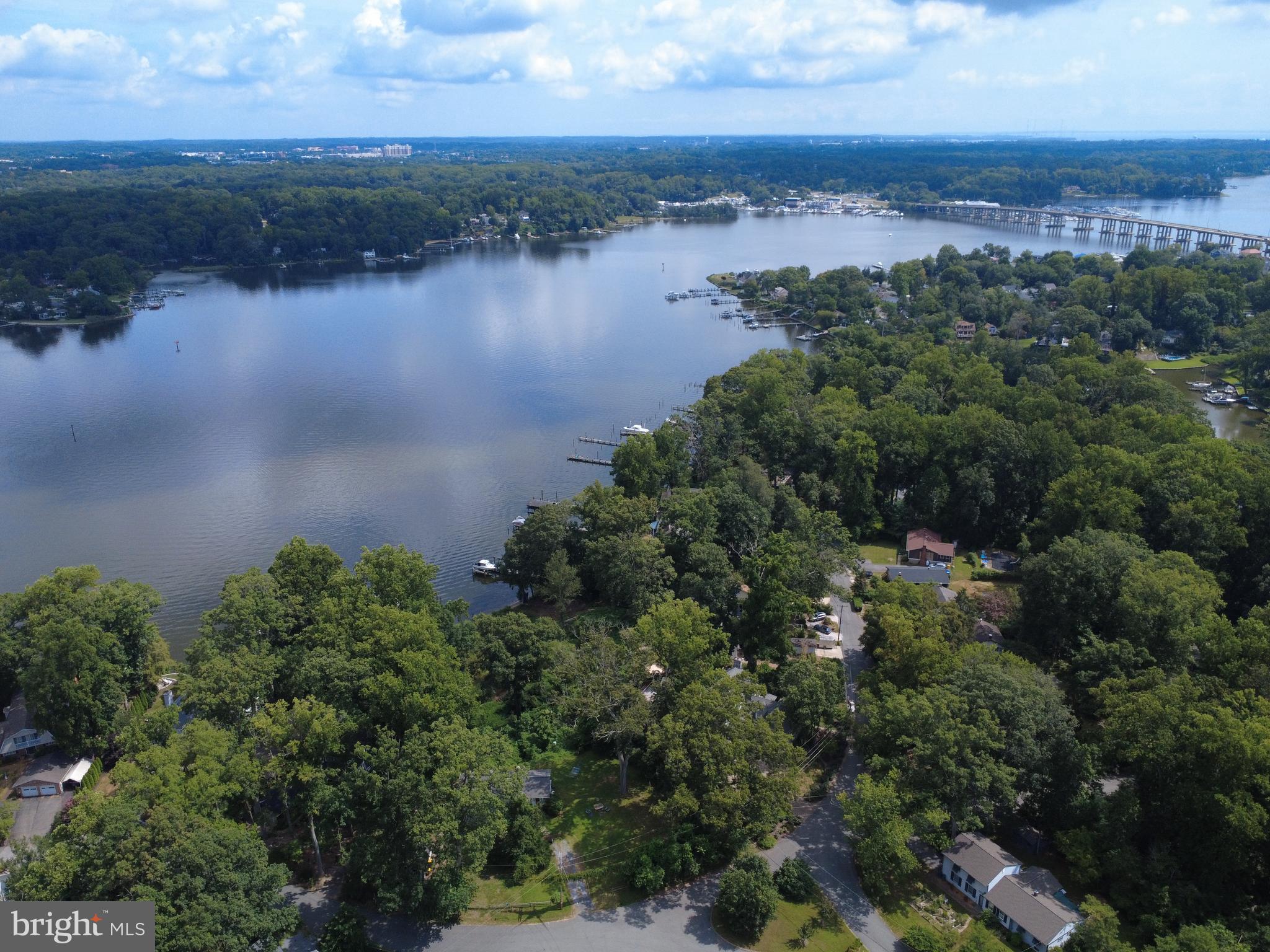 Nestled in the historic,serene waterfront community of Edgewater Beach, Shady Section, this home offers the best of what the Annapolis area has to offer — a short walk to multiple community beaches, scenic nature trails, and two private docks with available slips. This is where you will find your way home and not ever want to leave. Generations of owners will attest to this.
The timeless charm with this beautifully expanded 1930s cottage, perfectly blending classic character with modern updates defies photographic description - you must see it!
Imagine mornings on the front porch, greeting friendly neighbors, and evenings enjoying spectacular South River views from nearly every room. The open-concept layout is perfect for entertaining, featuring spacious, light-filled bedrooms and tastefully updated bathrooms.
The heart of the home is the kitchen and dining area, where expansive windows and sliding glass doors frame the grassy backyard and provide seamless access to a large deck and the waterfront yard beyond—perfect for relaxing, grilling, or simply soaking in the view.
With a non-mandatory HOA, you’ll enjoy added freedom and flexibility. Whether you're looking for a peaceful retreat or a vibrant community to call home, this gem offers it all. Don’t miss this rare opportunity!