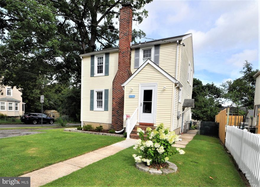 Motivated seller - just reduced 10K!  Adorable colonial home on a corner lot! Freshly painted with 3 bedrooms and 2 full baths.  Large Living rom with cherry wood build in cabinets and fireplace, Large Dining room that leads to a large kitchen.  Expansive covered deck, level yard fenced  & garage.  Hugh Lower level family room with gas fireplace.  This could be your man cave! Hardwood floors under carpet & central AC.  New sewer line, whole house attic fan - Home Warranty .  Now Virtually Staged.