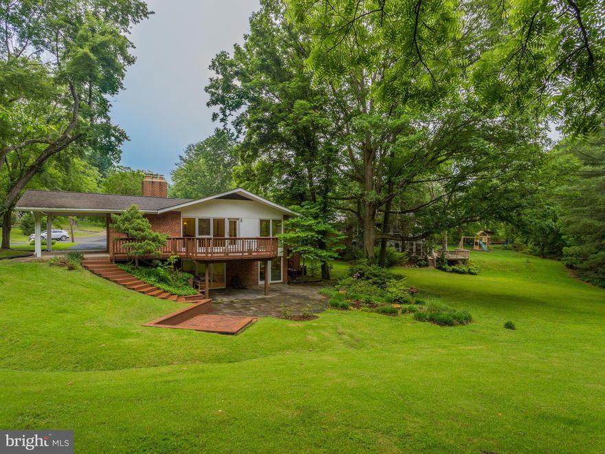 Rare premium half acre lot in Dowden Terrace at end of cul de sac- lovely rambler with hardwood floors, 4 bedrooms, 2 full baths, and a gorgeous deck overlooking trees and semi-private green space.  Walk to Dowden Terrace pool, Dora Kelly Nature Park and numerous trails and Holmes Run Stream.  Just minutes to 395, Mark Center, Baileys X-Roads, 7 Corners.  Short commute to DC. Brand new HVAC