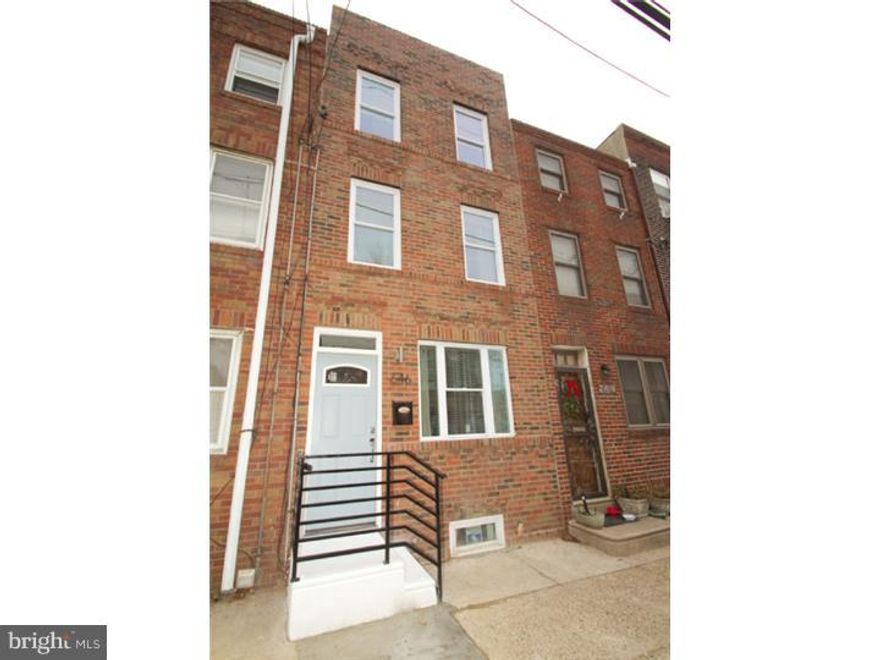 Wonderful 3 story Passyunk Square full renovation! This is an amazing find, located across the street from a beautiful green park, on one of the prettiest blocks in the area. This gorgeous home has a roofdeck with perfect skyline views, custom kitchen with granite countertops, stainless steel appliance package, handmade authentic backsplash made of quartz, porcelain and stainless steel, 42 inch cabinets and room for a dining area. The master suite level on the third floor has a beautiful bedroom, hardwood floors, recessed lights, large closet, access to the staircase that leads to the large top roofdeck and beautiful tile bathroom with walk-in shower with body spray and oversized designer showerhead, vertical tile patterns from floor to ceiling, designer fixtures and extra tall ceiling height. Other amenities include hardwood floors throughout, interior iron railing system, finished basement with tiled floors and extra storage area, perfect for a second living room!  Hardwired iPod dock and hardwired speakers included with this home- perfect for entertaining and enjoying your favorite tunes! Frosted glass custom interior doors, alarm system, bright cheerful and chic layout, not to mention this home actually has 2 bedrooms and 2 baths, each on their own separate floor, making it perfect for hosting guests for extended periods of time allowing them to have their own space and private bath with beautiful tilework and designer fixtures. This is not a cookie cutter renovation; this home is absolutely adorable and priced extremely well. Close to all the Passyunk Square eateries and attractions, plus down the street from beautiful green park- ideal for dog walking, picnicking and enjoying the beautiful area!