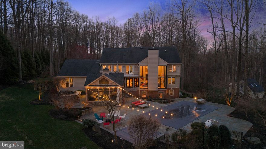 COMING SOON! If you are looking for custom, sleek, and truly move-in ready, this one-of-a-kind Clarksville home delivers at every turn. Situated on 3.25 private acres and completely redesigned by KUBE Architecture with no expense spared, this contemporary masterpiece offers 6 bedrooms, 4 full and 2 half baths, and a 3-car garage.  The striking modern design sets this home apart—there is simply nothing like it in the area. White oak hardwood, floating staircase, floor to ceiling windows, heated bathroom floors - all design features stand out. At the heart of the home is a chef’s kitchen featuring top-of-the-line appliances, custom cabinetry, and an open layout perfect for everyday living and entertaining. Step outside and experience a true resort lifestyle with a screened porch, pool with a stone diving board, outdoor kitchen, and a professional putting green - plus a fully equipped in-home gym. Perfectly located with ultimate privacy yet close to everything in DC and Baltimore, including top-rated schools, this home offers a rare combination of luxury, lifestyle, and location. A spectacular alternative to new construction without the wait.