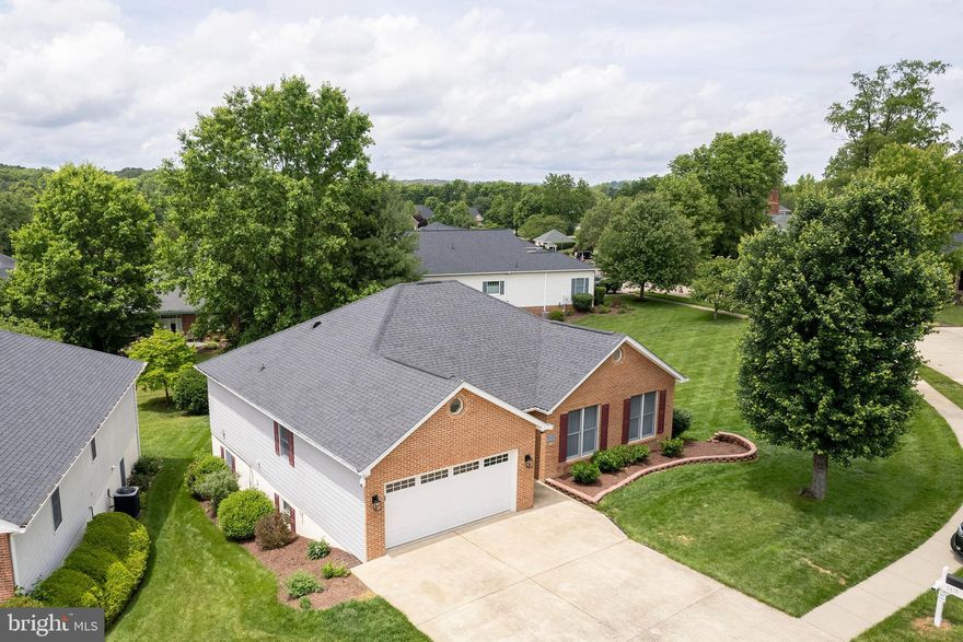 Spacious 4 bed / 3 bath brick-front rancher located in the City of Winchester, just minutes from Winchester Medical Center, the library, shopping, dining, and historic downtown. Enjoy community amenities at Early’s Green at Meadowbranch, including an outdoor pool and tennis courts. This home offers true one-level living with the added bonus of a fully finished basement featuring a custom-built bar—perfect for entertaining, hobbies, or extra living space. The home is filled with high-end features, including a Generac whole-house generator, under-cabinet lighting, premium lighting in the den, and hardwood floors (refinished in 2026) throughout. An alarm system (intruder, fire, smoke & CO2) and CCTV system (23 cameras) installed by ScifiHomes. The gourmet kitchen, updated in 2021, is a chef’s dream with two dishwashers, a trash compactor, two wall ovens with a warming drawer, a spice drawer, a mixer lift cabinet, and a beverage cooler—designed for both everyday living and hosting. Step outside to enjoy the deck and patio, complete with a dedicated storage area underneath. Major updates include a new roof and water heater in 2020, along with a new HVAC system and furnace in 2024. The home also features a freshly painted interior in 2026. 

A well-maintained, feature-rich home in a prime Winchester location—close to everything, yet tucked into a neighborhood with great amenities.